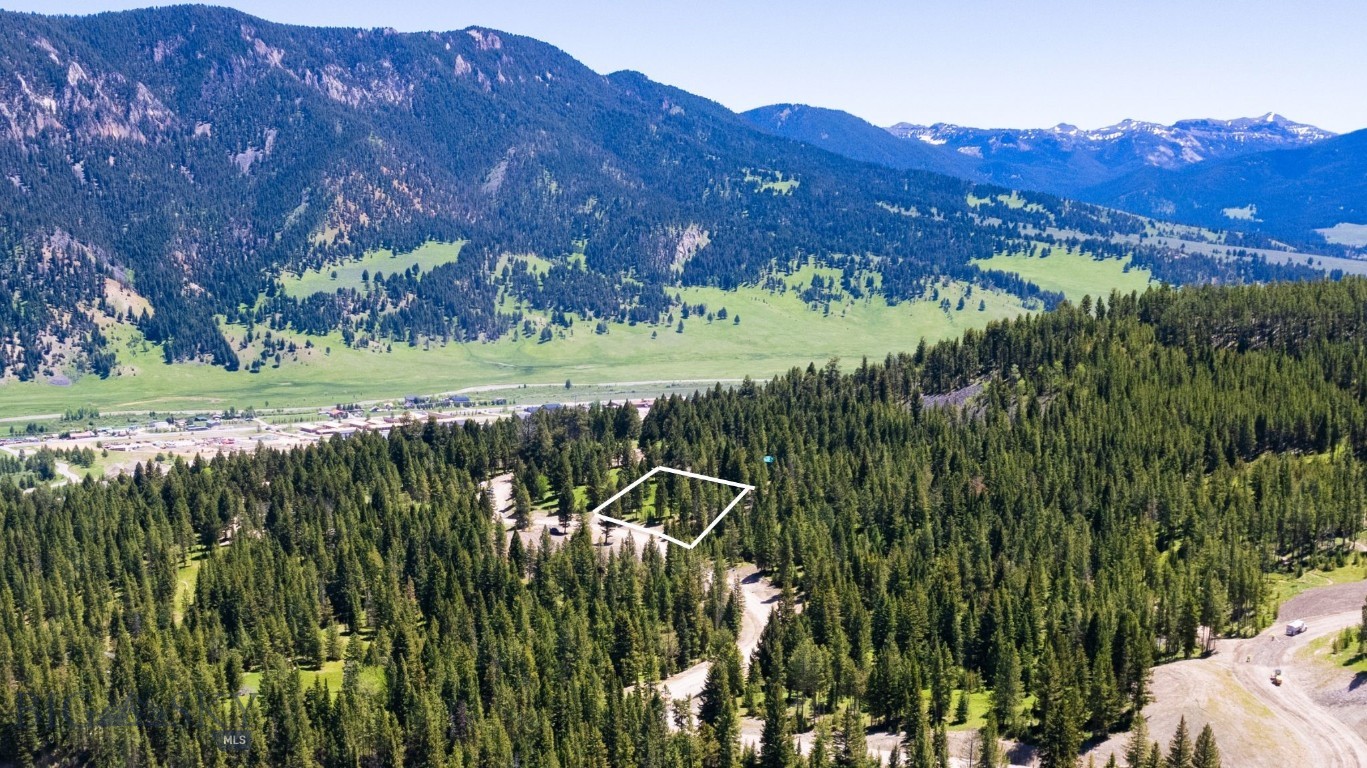 Gallatin Foothills Phase 2 Lot 29 offers massive open views on its gentle sloping terrain, making it ideal for a home with a walk-out basement. Bordering over 26 acres of open space, this lot ensures unobstructed views and privacy within the community. Introducing Gallatin Foothills Phase 2, where residents will revel in spacious lots ranging from 1 to 2 acres, complemented by over 75 acres of dedicated open space. Each homesite, complete with mature trees and privacy, has been meticulously selected and designed to capture breathtaking sunrise and sunset views, alpenglow, and expansive mountain vistas, all while remaining conveniently close to town amenities. Neighborhood amenities include world-class Terra Flow mountain biking trails, sledding hills, and parks with open spaces perfect for hiking and cross-country skiing. At the base of the development, a trail network provides access to public lands, ideal for snowmobiling, ATV riding, and mountain biking. Fishing enthusiasts will appreciate the incredibly convenient 5-minute access to the Gallatin River.  A short drive brings you to Big Sky’s Town Center, Big Sky Resort, and an even shorter trip to Ophir Elementary School, Lone Peak High School, the Warren Miller Performing Arts Center, and countless trailheads and recreational opportunities.  Reach out for your tour today of Big Sky newest neighborhood