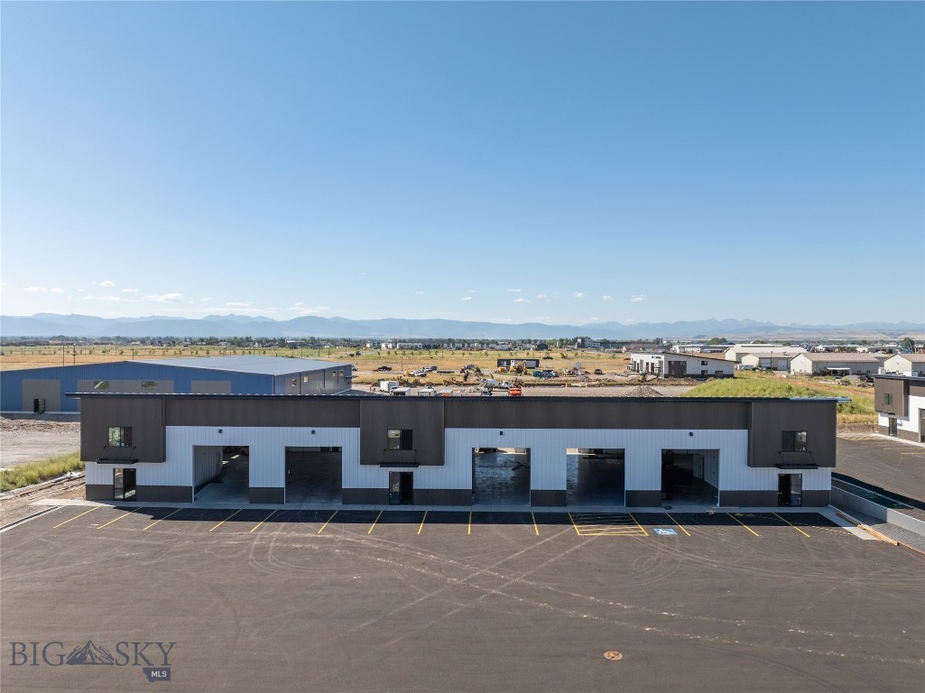 Now available in Belgrade’s sought-after West Post development, this brand-new 6,500 SF end-unit warehouse offers exceptional versatility, high-quality construction, and prime accessibility for a wide range of commercial or light industrial uses. The space includes a carpeted mezzanine office area ideal for day-to-day operations, 3-phase power, and a bathroom for staff convenience. There is approximately 620 SF of upstairs mezzanine space included in the 6,500 SF total. The building features multiple overhead doors, including a 14-foot front-facing door for customer or equipment access and a 10-foot rear door designed for efficient loading and logistics. As an end unit, the property is equipped with a dedicated loading dock and approximately 50 feet of yard space suitable for outdoor storage, parking, or equipment maneuvering. With quick access to I-90 and Jackrabbit Lane, this modern warehouse provides an ideal balance of functionality, adaptability, and premium construction in one of Belgrade’s most desirable commercial locations.