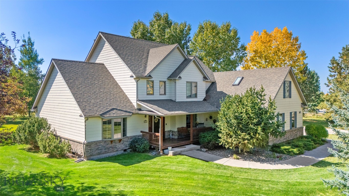 Experience the rare combination of privacy and convenience in this beautifully maintained, single-owner home on 1.55 acres in Lazy TH Home Estates, just south of Bozeman. Surrounded by mature trees and offering mountain views from the second story, this property feels like a peaceful retreat while remaining just minutes from Montana State University, shopping, dining, and all that Bozeman has to offer. The thoughtfully designed 4-bedroom, 2.5-bath home features a spacious main-level primary suite with dual walk-in closets, a jetted soaking tub, and a separate shower. The open-concept living area boasts soaring ceilings and expansive south-facing windows that fill the home with natural light and frame the beautiful Montana landscape. The kitchen is appointed with quality Cherry wood cabinetry, quartz countertops, and an ideal layout that serves both the formal dining room and the casual dining area. Step outside to the large deck, perfect for entertaining or simply relaxing while enjoying the peaceful surroundings. Upstairs are three additional bedrooms and a full bath. The oversized bedroom with skylights is currently used as an office and includes a generous walk-in closet, offering excellent flexibility for a variety of uses. Generous two car attached garage and adjacent room with electrical transfer switch for back-up generator. A standout feature is the impressive 20' x 40' RV garage with oversized drive-through doors, its own electrical service, attached workshop, and additional storage—ideal for recreational vehicles, hobbies, or extra workspace. Enjoy easy access to South 19th Avenue, Montana State University, downtown Bozeman, and the outdoor recreation of Hyalite Canyon, where boating, camping, hiking, and the area's iconic waterfalls await. This exceptional property offers space, privacy, and Montana living at its finest. Located Less than 90 miles to Yellowstone National Park. SHOWINGS TO START MONDAY JUNE 29th.