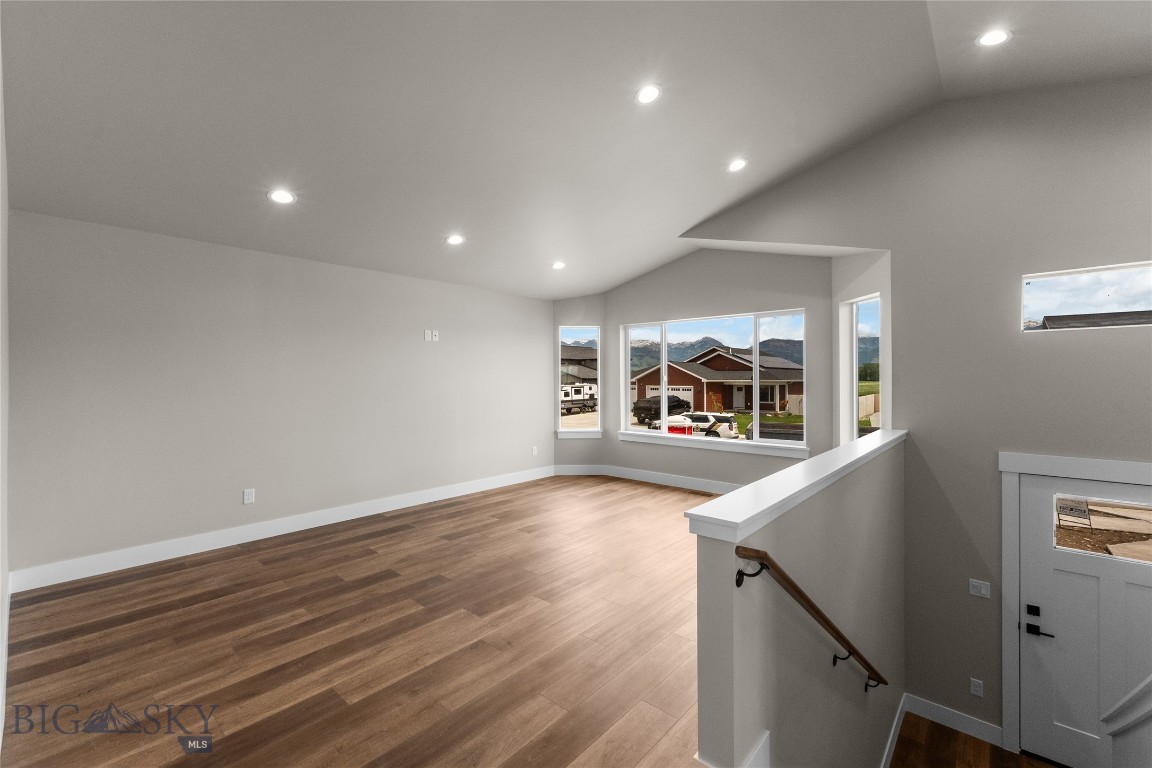 Bring your toys!! Large 3 Car Garage!! Welcome to this beautiful new construction home! An inviting entryway leads up to a spacious living room with expansive windows that fill the area with natural light. The open concept design flows seamlessly into the kitchen, complete with abundant storage, a large corner pantry and direct access to the dining area. Open the big sliding door and step out onto the deck - ideal for entertaining or enjoying quiet
evenings. The upper level includes a private primary suite with an attached bath and generous walk in closet. An additional bedroom and full bath complete this level. The lower level of this home features a large family room, 2 additional bedrooms and full bath all with daylight windows! This home is a must see! *PHOTOS OF A SIMILAR  HOME
