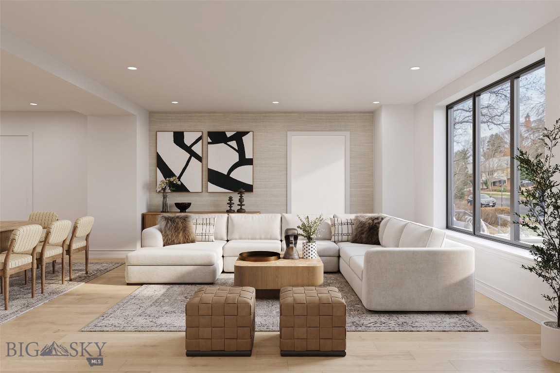 This is an unparalleled opportunity to own Residence #104 at The Henry, a six-story luxury condominium building situated in the heart of Downtown Bozeman. Spanning a generous 2,394 square feet across two levels, this exceptional unit delivers the spaciousness and privacy of a townhome while offering the sought-after amenities of a condominium, including its own private, street-side entrance. The bright and airy interior features meticulous finishes, including sophisticated engineered oak hardwood floors, plush wool carpeting, quartz countertops, and a gourmet kitchen equipped with top-of-the-line Bosch appliances and high-end fixtures. The versatile layout encompasses two bedrooms, a dedicated den, and two and a half bathrooms. The Henry building elevates the residential experience with amenities such as a ground-floor fitness center, a private, beautifully landscaped courtyard, and climate-controlled, secure underground parking. Located just three blocks from the vibrant shops and dining of Main Street, and offering effortless access to world-class recreation, 25 minutes to Bridger Bowl and 45 minutes to Big Sky Resort, this ready-made luxury offering places you perfectly between the stunning natural landscapes of Montana and the energetic core of the Rocky Mountains' coolest town.