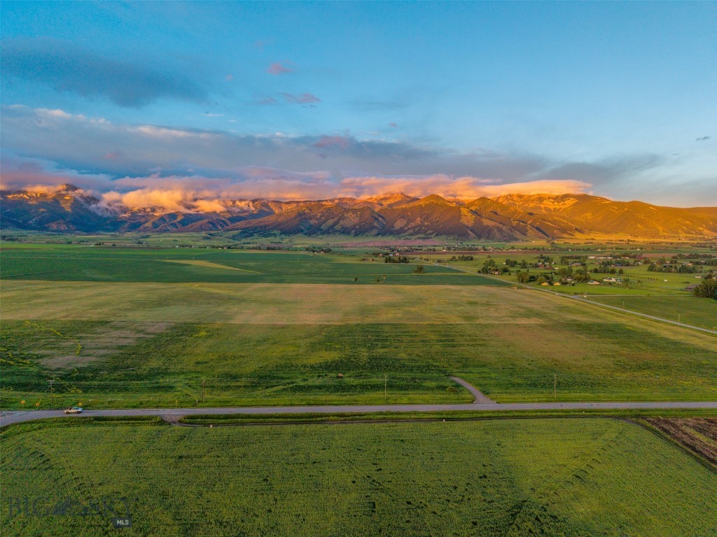 Estate Property- Introductory offering! Discover the perfect blend of natural beauty and tranquility with this stunning 20.80-acre property nestled in the heart of the Springhill area right outside of Bozeman, Montana. Situated under the majestic Ross Peak, this parcel offers breathtaking views and open space, creating an idyllic setting for your dream home or retreat. Located a short 15 minutes from downtown Bozeman, this property offers the perfect balance of seclusion and accessibility to city amenities, including dining, shopping, and cultural attractions. This is a rare opportunity to own a piece of Montana's natural splendor where the wildlife is abundant. Whether you're seeking a peaceful escape or a place to build your legacy, this land offers endless possibilities. Don't miss the chance to make this extraordinary property your own. Contact us today for more information or to schedule a viewing. Electric and gas lines to lot. There is a 3 acre building envelope to help secure the farm land environment.