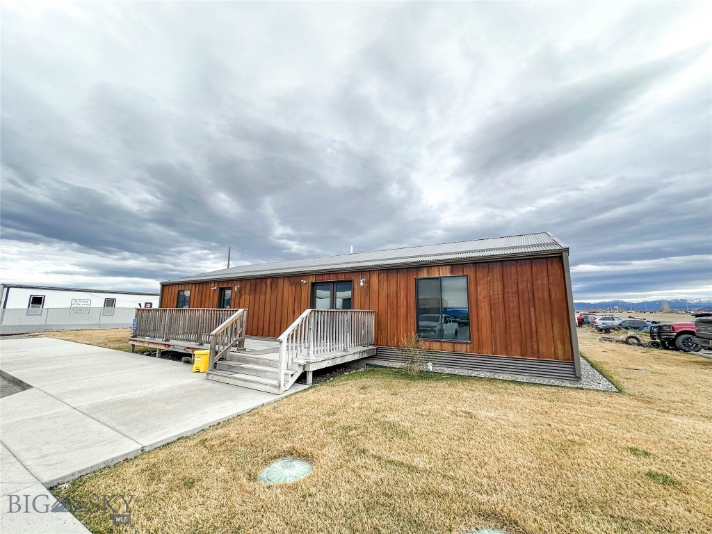 2,000 SF Office Building located off of Jackrabbit Lane, between Four Corners & Belgrade! This great office space features 3 private offices, build in work stations, kitchenette, bathroom w/ shower, and larger conference room or training center. There is also a large deck space for outdoor enjoyment. The larger property features more office and a shop with a 2 acre fenced yard. The property is well maintained with nice landscaping and paved parking. 
This space is ideal for small contractors, service providers, showroom needs, etc. Available now! Tenants pay taxes, insurance and their share of snow/landscaping, & utilities