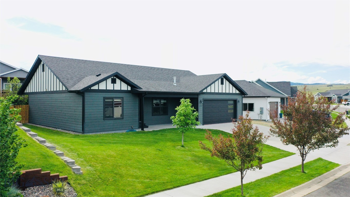 This single-level home offers 3 spacious bedrooms, 2 bathrooms, and 1,890 sq. ft. of living space. Built in 2018, the open floor plan connects the living, dining, and kitchen areas for comfortable everyday living and entertaining. The living room features a gas fireplace and a large picture window that overlooks Livingston Peak and the Absaroka Mountain Range. The kitchen includes custom cabinets with under-cabinet lighting, a large island, gas range and ample storage. Beautiful alder wood trim is featured throughout the home and additional amenities include forced-air heat, central air conditioning, and an attached two-car garage with an epoxy-coated floor. Outside, the fully fenced backyard includes raised garden beds and space to enjoy the already blossoming strawberry patch. Sitting on a 7,928 sq. ft. lot located in the Discovery Vista Subdivision, the home is conveniently located near neighborhood parks, trails, and other outdoor recreation opportunities. Schedule your showing today!