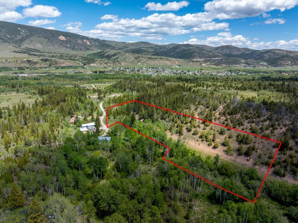 Rare Montana acreage bordering Garrity Wildlife Management Area! This nearly 4-acre parcel offers an incredible opportunity to build your dream home, cabin, or recreational retreat in one of the area’s most sought-after settings. With direct gated access into Garrity Wildlife Management Area and the entire back boundary adjoining protected land, you’ll enjoy unmatched privacy, abundant wildlife, and endless outdoor adventure right out your back door.

Wake up to breathtaking mountain views, watch deer and elk roam the property, and enjoy the peace and serenity of true Montana living while still being conveniently located just minutes from Anaconda. Warm Springs Creek is only a short distance away, offering excellent fly-fishing opportunities, while Georgetown Lake is just 15 minutes away and Discovery Ski Area is only 25-minute away.

This property provides the perfect balance of seclusion and accessibility, with grocery stores, schools, and the hospital all within approximately 12 minutes. Whether you’re looking for a year-round residence, a vacation getaway, or an investment property, this is a rare chance to own acreage that directly borders protected wildlife habitat.

Power is on site and approved for well and septic.