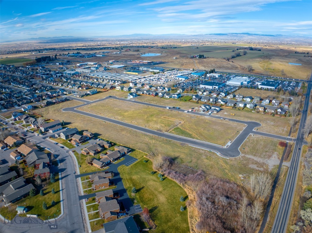 New single-family subdivision lots ready to build. Woodbury Grove Subdivision combines the beauty of Montana's rural landscape with the convenience of living just minutes from everything Bozeman has to offer. This subdivision offers wide streets and sidewalks creating a neighborhood feel rarely found outside Bozeman city limits. A Master Plan designed to create multiple living options from single family homes to townhouse lots and a few condo units will create an intimate community for every home as the development grows. Traditional architecture, responsible design, quiet streets, and more make Woodbury Grove perfect for families with children to build a community together over time. Located on the west side of Bozeman, 10 minutes from downtown or to the Gallatin River.