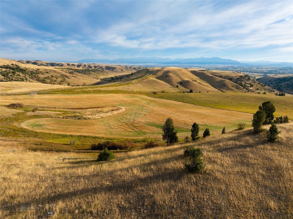 Rare opportunity! Secure your slice of Montana paradise at TBD Stampede Trail, nestled within the exclusive, gated Montana Ranch. This exceptional acreage offers ultimate privacy and stunning mountain and Gallatin Valley views. Horses are welcome!  Montana Ranch is a meticulously planned community that harmonizes luxury living with environmental preservation. Enjoy the security of a gated entrance, paved roads, and incredible 360-degree vistas. This specific parcel on the southern border adjoins the vast Flying D Ranch, ensuring protected and unobstructed views – watch for the roaming bison!  Amenities abound with a community horse barn, corrals, and 10 miles of private hiking/riding trails. Adventure calls from your doorstep: world-class fishing on the Gallatin (5 min), Madison (25 min), and Yellowstone (45 min) Rivers. Skiers rejoice with Big Sky Resort and Bridger Bowl just 45 minutes away. Local dining in Gallatin Gateway is minutes from home, and both Bozeman Yellowstone International Airport and vibrant Downtown Bozeman are an easy 25-minute drive.
Don't miss out. Contact your agent today for a showing!