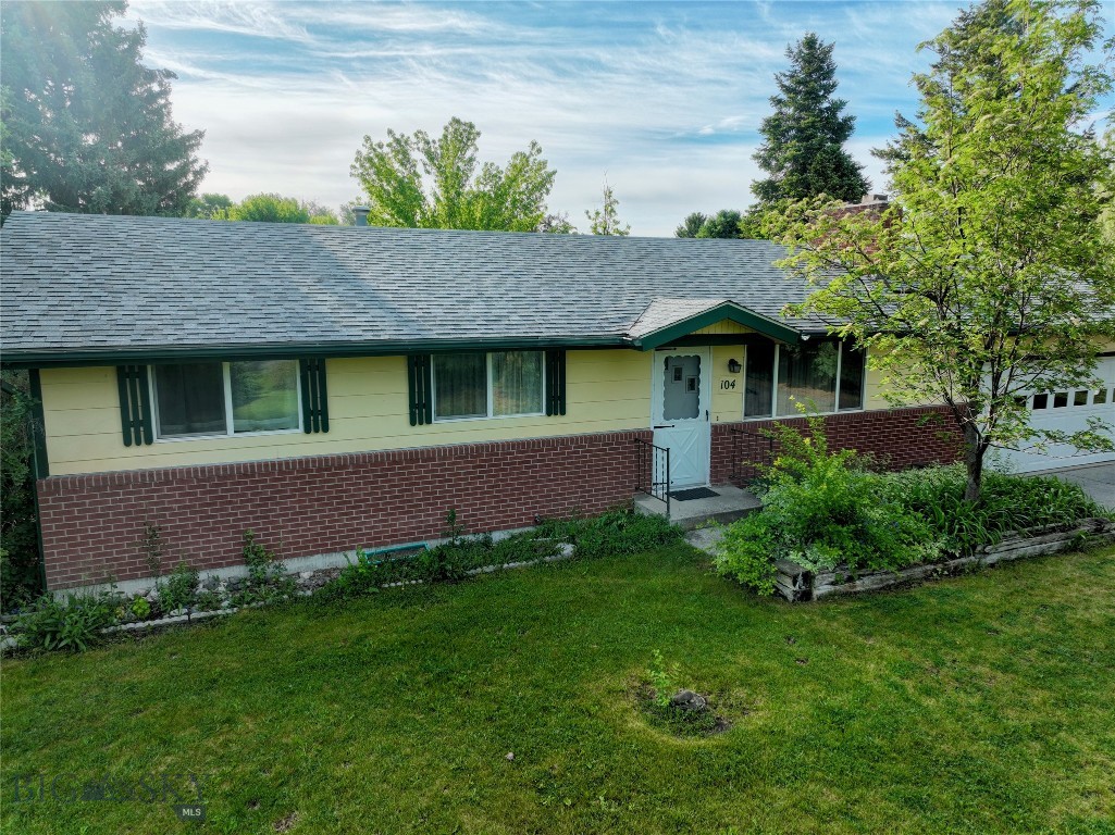 Opportunity awaits at 104 Arrowhead Trail! Situated on a spacious 0.54-acre lot, this 3-bedroom, 2-bathroom home offers the space, flexibility, and potential that today's buyers are seeking. The main level features 1,113 square feet of living space, while the partially finished basement provides an additional 1,113 square feet, creating opportunities for expanded living areas, storage, hobbies, recreation, or future customization.

Outside, the generous lot offers ample room for entertaining, gardening, outdoor activities, or simply enjoying the privacy and open space of your own backyard retreat. Whether you're envisioning summer barbecues, a play area, or room for pets to roam, this property provides the space to make it happen.

Conveniently located near schools, parks, and local recreational amenities, this home also benefits from its proximity to Big Sky, offering convenient access to world-class skiing, hiking, mountain biking, fishing, and year-round outdoor adventure. Enjoy the charm and affordability of small-town living while remaining within easy reach of one of Montana's premier resort destinations.

With over 2,200 square feet of combined main-level and basement space, a large lot, private well and septic, and abundant potential to add value and make it your own, this property presents an outstanding opportunity for homeowners, investors, or anyone looking to enjoy the Montana lifestyle in a desirable location.