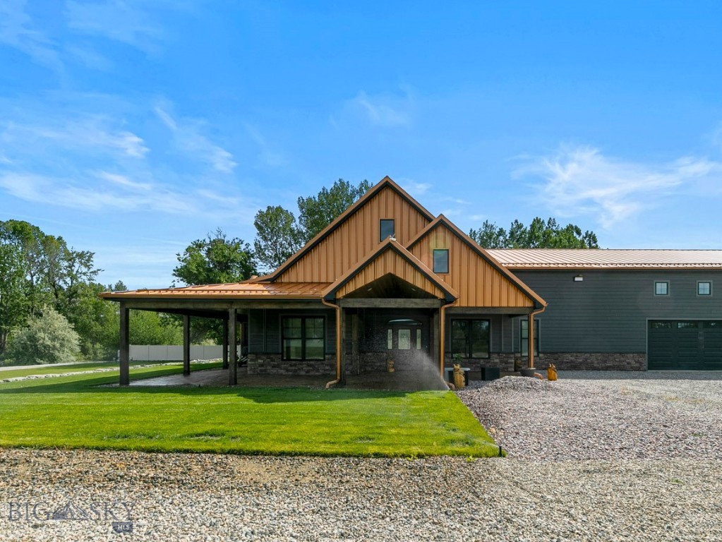 Built in 2023, this stunning ranch-style barndominium of living space and shop space on 1.5 acres along the beautiful Stillwater River. This 3-bedroom, 3.5-bath home features a striking blue pine vaulted ceiling, radiant-heated stained concrete floors, and an open-concept design perfect for entertaining. The kitchen is equipped with custom cabinetry, quartz countertops, central AC, and commercial-grade appliances. The spacious primary suite and main bath include classic bidets and thoughtfully designed private spaces. Outside, enjoy a wraparound stamped concrete porch, custom rockwork, iron fencing, and detailed landscaping. Relax with stunning Montana sunsets, river views, and the peaceful sounds of flowing water and wildlife right from your own backyard.