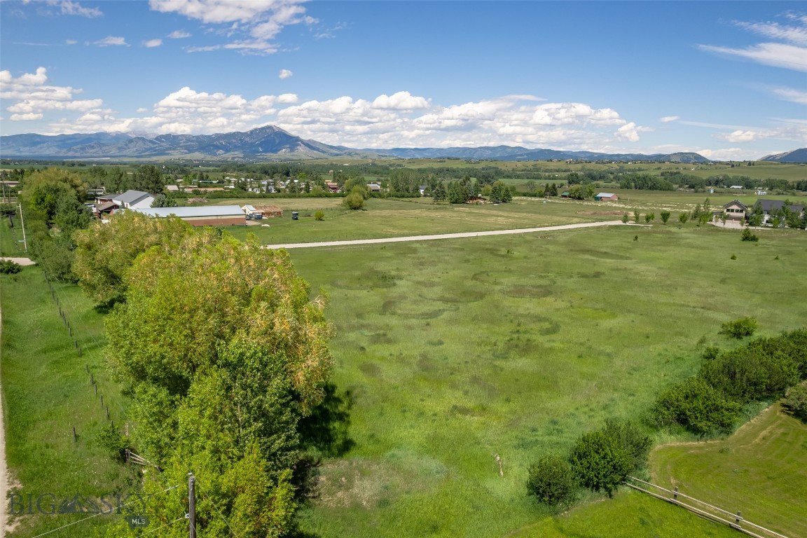 This is a beautiful, flat, undeveloped 5 acre parcel of a two lot Minor Subdivision with views in every direction. There is infrastructure in place for fire suppression which includes underground storage tanks, fire hydrant hookups per the county requirements for subdivision approval. Buyer will be responsible for their own private well, septic system and bringing power from the road to the build site. This is a superb location, close to downtown Bozeman, MSU and Hyalite Canyon, among others. Views of Mt Ellis and Frog Rock to the East. The nearby Gallatin Mountain Range offers many access points for all types of recreation for both Winter and Summer months. Design and build exactly what you are looking for. Call for more details or to schedule a showing.