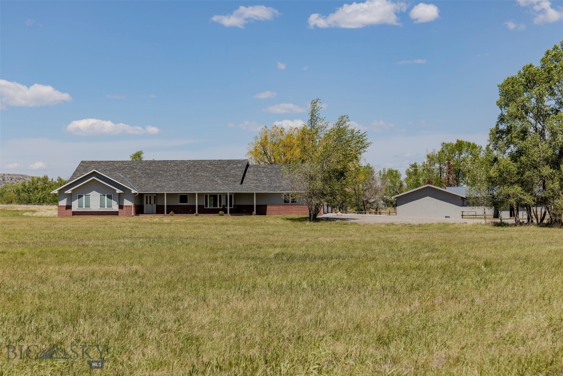 A comfortable blend of space, functionality, and Montana charm right on the edge of Big Timber. This 13.32 acre property includes a thoughtfully designed 3464 sq ft ranch-style home that makes great use of every inch. The main house offers a large kitchen with tons of cabinetry, a generous pantry, and an open living room with cathedral ceilings and a cozy gas fireplace. In addition to a dedicated office space, there are three bedrooms, including a spacious primary suite with a fantastic walk-in closet. The acreage is well set up for animals or small-scale hay production with water rights, a small pivot, and useful outbuildings like an old corral, grain bin, loafing shed, and a large shop. A second, more modest manufactured home adds flexibility for guests or potential rental income. With productive land, practical improvements, and a well-designed main home, this property offers a rare chance to enjoy rural living while staying close to the conveniences of town.