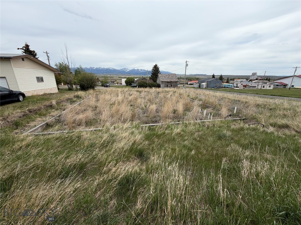 Bring your vision for whatever use you desire with this flat city lot with Mountain views.  Power is to the corner.  Water hookup available for city water and some plumbing pipes in if you wish to keep a similar plan or lot layout.  Has been approved for septic but no septic installed.