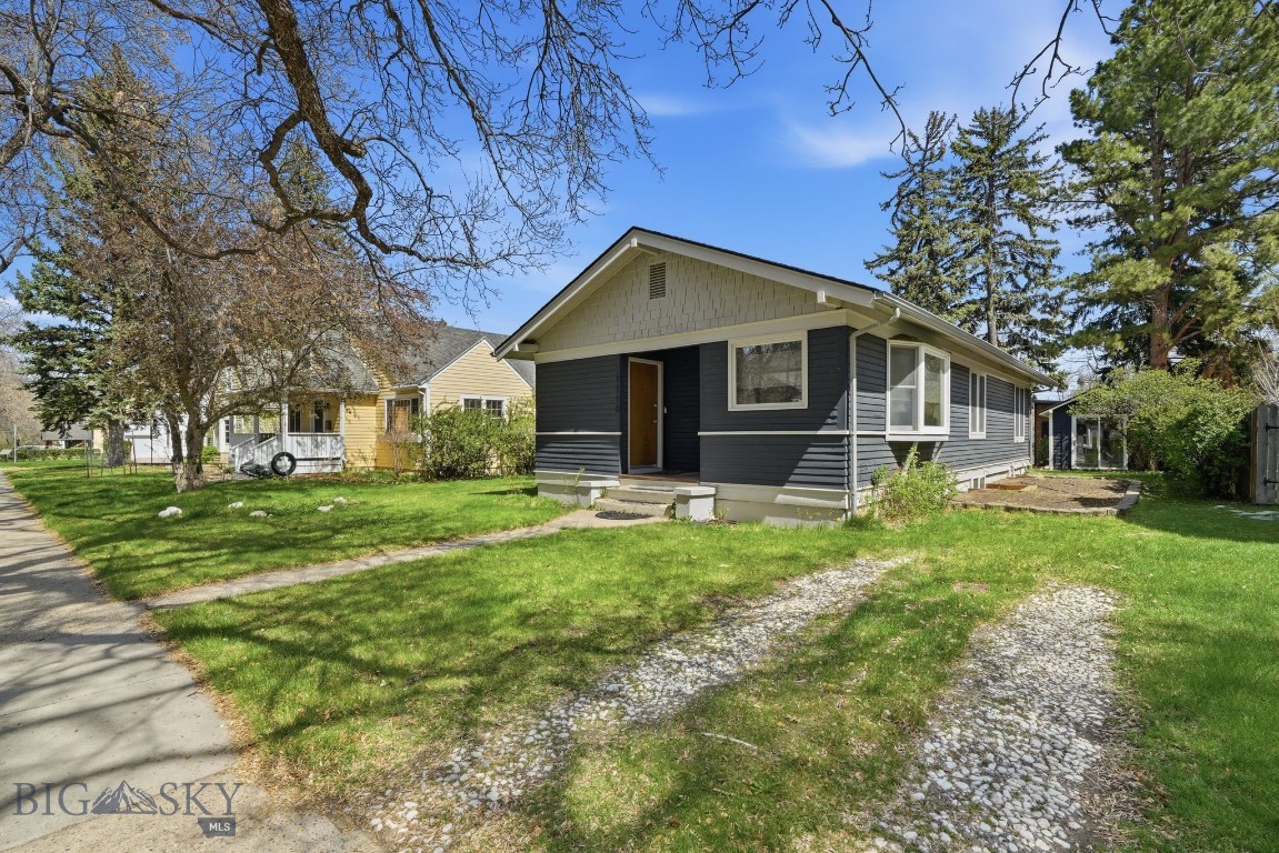Charming Southside bungalow in one of Bozeman’s most desirable locations, just minutes from Montana State University, downtown Bozeman, parks, trails, and restaurants. This beautifully updated 1926 home offers approximately 1,931 square feet, 3 bedrooms, and 2 bathrooms, blending timeless character with modern updates.
Features include refinished hardwood floors, original trim and wood doors, a cozy gas fireplace, and an updated kitchen with stainless steel appliances and induction range. The lower level offers additional living space with a bedroom area, office/flex space, remodeled 3/4 bath, finished concrete floors, and excellent natural light from two egress windows.
Situated on a spacious, landscaped lot with mature trees, the property also includes a large backyard, east-facing deck, detached garage built in 2024 with EV hookup, new exterior paint, abundant parking, and a charming storage shed/studio space. Move-in ready and full of classic Bozeman charm!