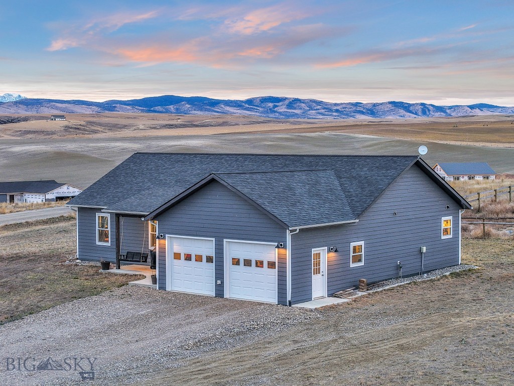 Set on over an acre with stunning mountain views and neighboring subdivision common ground, this 2022 home delivers the space, freedom, and functionality buyers are actively searching for. Inside, a bright open layout with vaulted ceilings creates an airy, inviting feel, anchored by a standout primary suite featuring an oversized walk-in closet that truly delivers.

The property is designed for how people actually want to live. A usable, low-maintenance yard includes a fenced area ideal for chickens, gardening, pets, or future projects, giving you flexibility without the upkeep.

Beyond what you see, this home was built with intention. Buried gutters direct water efficiently away from the home, and a full home water filtration system is already in place, offering added peace of mind and long-term confidence.

Evenings are best spent on the back patio taking in Big Sky sunsets, while nearby access to the Headwaters Trail System, Copper City Trails, and Missouri Headwaters State Park keeps outdoor adventure within minutes.