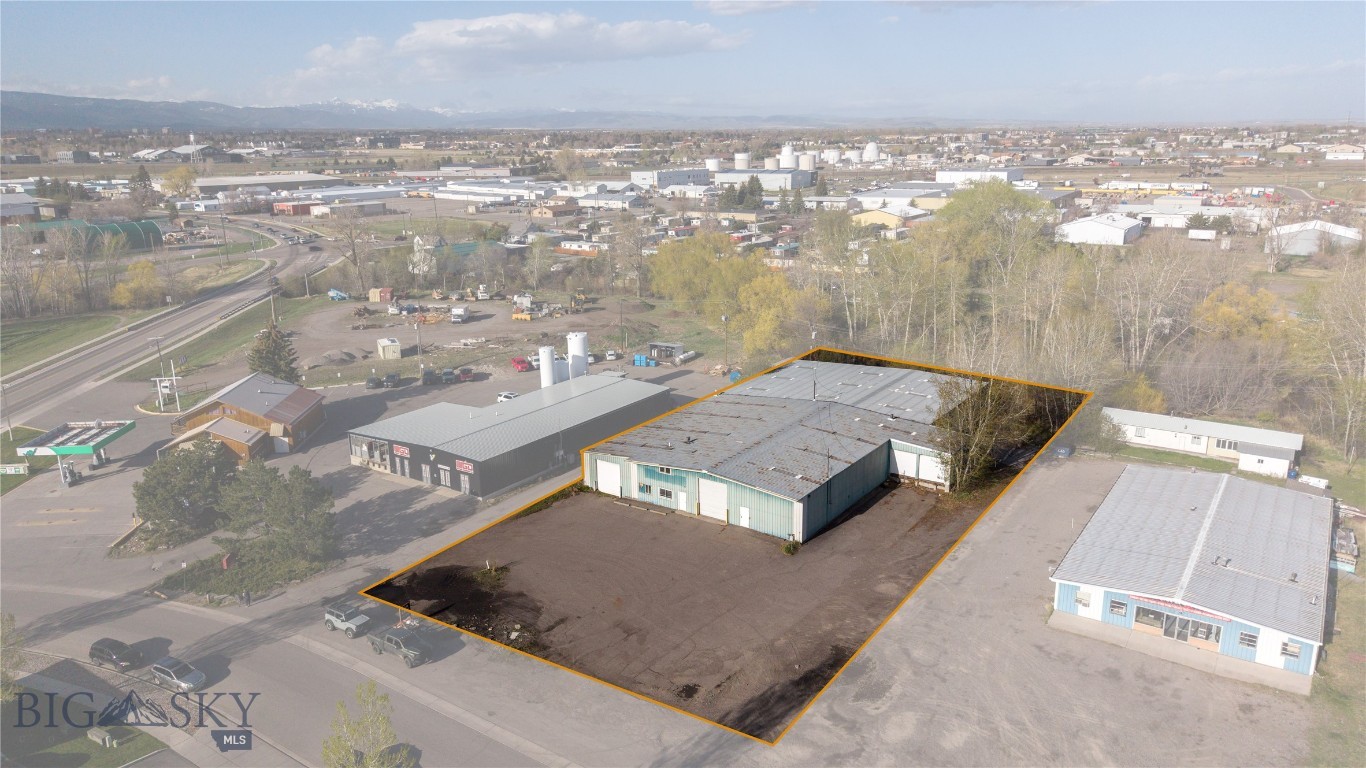 Hard to find large-scale industrial property for sale in Bozeman's northeast commercial neighborhood. Approximately 17k sq ft of flex industrial space is located on an acre. Ideal for industrial, storage, and manufacturing needs. Loading docks and a large parking lot. Multiple overhead doors, pull through options, floor drains, small office. This property meets many large-scale industrial needs, this is a unique blank slate for all your business needs!
