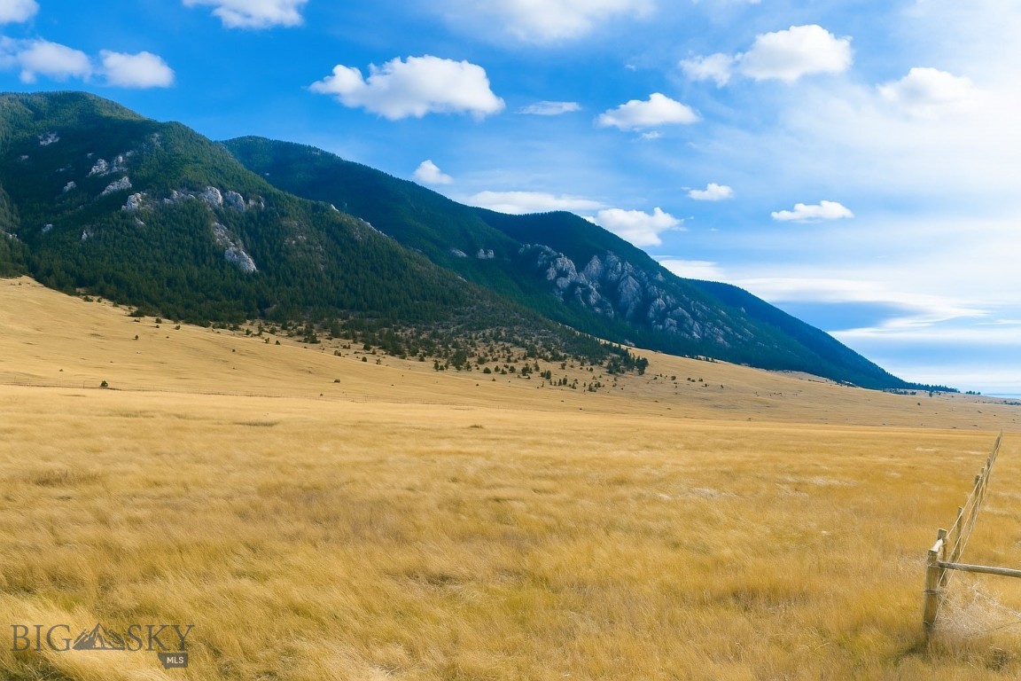 86-B Storter First Minor Subdivision on Songbird Lane – Madison Valley, Montana Private 5-Acre Homesite Bordering National Forest & Lee Metcalf Wilderness A rare opportunity to own one of the most unique homesites in the Madison Valley. Situated at the end of McDeed Creek Road in the Mustang Ranches neighborhood, this newly created 5-acre parcel offers unmatched privacy, panoramic mountain views, and direct access to public land. The property’s eastern boundary touches the Beaverhead-Deerlodge National Forest and the Lee Metcalf Wilderness. Step out your back door and into thousands of acres of protected wild country, with no public trailhead nearby, giving you an incredibly private gateway into pristine Montana backcountry. With big-sky vistas, this property is the perfect canvas for your Montana dream home, cabin, or recreational retreat. Wildlife is abundant, including elk, deer, pronghorn, and a variety of raptors and songbirds. It is an ideal setting for nature lovers, hunters, and outdoor enthusiasts. Electricity is nearby, light covenants protect property values, and Mustang Ranches owners enjoy private road access and the peaceful setting of a low-density rural neighborhood. All this just minutes from the historic town of Ennis, the blue-ribbon waters of the Madison River, and an easy drive to Yellowstone National Park and Bozeman. Build your legacy property in one of the most scenic and sought-after valleys in Montana, where wilderness, privacy, and wide-open spaces meet modern mountain living.