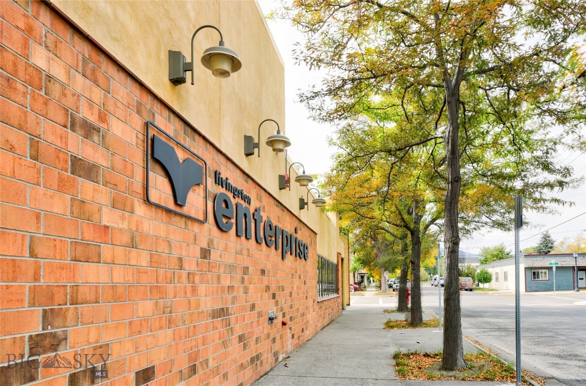 First time on the market for this very well built building that has 5,088 square feet of office space and 5,287 square feet of high ceiling warehouse/shop space with an ideal location on Livingston's Main Street. The lot is over 25,000 square feet providing good combination of both street and off street parking. A creek meanders behind the building and there is a loading dock to the shop warehouse space.
The office portion has private offices, conference room, open space and two dark rooms. The office has central heat and air and has a sprinkler fire suppression system The shop/warehouse has gas space heaters and is cooled by two swamp coolers and also has a sprinkler fire suppression system. 
Building site was excavated and gravel filled and extra footings exist from the office area for future expansion if needed. This is a very unique and versatile property that would lend itself to a variety of uses. Bring your ideas and take a look.