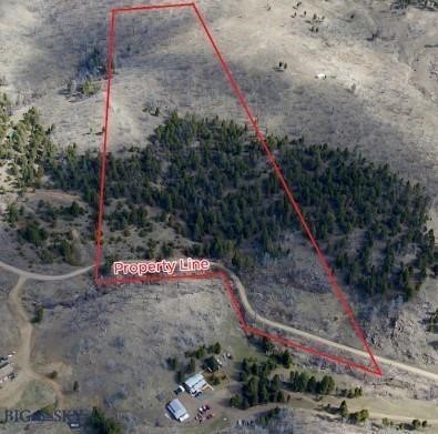 Discover the perfect canvas for your mountain retreat. This expansive 20.43-acre parcel on Friendspring Road offers the quintessential Montana experience, featuring dramatic boulder outcroppings, native grasses, and mature trees. Situated between Butte and Whitehall, the property boasts staggering panoramic views of the Tobacco Root Mountain Range and the Jefferson Valley.