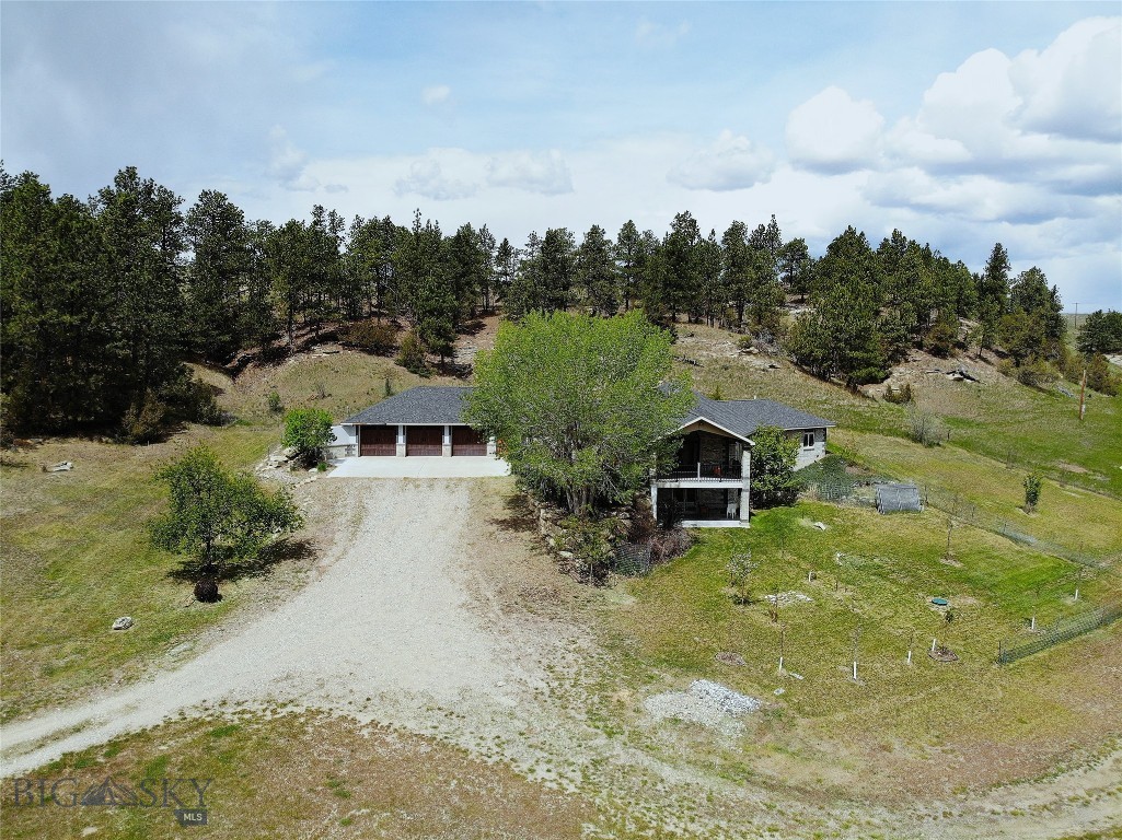 Set on 30.63± acres in the heart of Ryegate, this custom-built home offers the kind of space and freedom that many buyers spend years hoping to find. Built in 2005, the home features 4 bedrooms, 3 bathrooms, and 4,284± square feet with a full walkout basement, providing plenty of room for family, guests, hobbies, entertaining, or multi-generational living.
Surrounded by mature landscaping and wide-open views, the property feels peaceful, private, and wonderfully removed from the noise of everyday life. Large windows fill the home with natural light while capturing the beauty of the surrounding countryside. Whether it's coffee on the deck, evenings with family, or simply enjoying the quiet, this is a place meant to be lived in and enjoyed.
The fenced acreage offers endless possibilities for horses, livestock, 4-H projects, gardening, or simply having the elbow room that is becoming harder and harder to find. An additional outbuilding is already in place and is ideal for small animals, storage, hobbies, or a workshop.
One of the property's unique features is its versatility. While a portion lies within the city limits of Ryegate, approximately 16± acres on the upper portion extend outside the city limits, offering additional possibilities and added privacy.
Wildlife is a regular visitor, the stars shine brightly at night, and the pace of life feels refreshingly simple. Located approximately 60 miles northwest of Billings, Ryegate offers a K-12 school, local amenities, and a strong sense of community rooted in agriculture, recreation, and neighborly values.
Whether you envision horses in the pasture, a large garden, children with room to explore, or simply a place where family and friends naturally gather, this property offers something that cannot be manufactured or duplicated: the opportunity to enjoy life on your own piece of Montana.
Because in the end, land is more than acreage. It's freedom, memories, and a place to call home.
