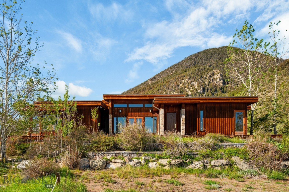 Nestled in the heart of one of Southwest Montana’s most coveted and scenic regions, MJS Ranch offers an exceptional opportunity to own 1,416± acres in the stunning Madison Valley, just outside Cameron and 20± minutes from the charming town of Ennis. This end-of-the-road property is bordered by 2.5± miles of National Forest and wilderness area, ensuring unmatched privacy and direct access to thousands of acres of pristine wilderness. From nearly every vantage point on the ranch, breathtaking panoramic views stretch across the Madison Valley and out to the towering peaks of the surrounding mountain ranges, creating a majestic and inspiring backdrop. The world-famous Madison River, offering blue ribbon trout fishing, is just 7± miles from the ranch entrance at the Varney Bridge Fishing Access.

The ranch is graced with over 2 miles of Tolman Creek and half a mile of Mill Creek, providing excellent water resources for stock and wildlife. The land is well-suited for productive agricultural use with approximately 100± acres under pivot and 50± acres under flood irrigation. It supports a viable cattle operation with capacity for 80 pairs, bolstered by two additional summer grazing leases.

Improvements on the property include a beautifully crafted 3,100± square foot main home, featuring three bedrooms, three and a half bathrooms, a home theater, and an attached two-car garage with ample storage. The secondary residence, a 896± square foot cabin, offers four bedrooms and two bathrooms, making it ideal for guests or a manager’s quarters. The ranch is well-equipped for equestrian and agricultural use, with an indoor riding arena housing seven stalls, a tack room, a barn, a hay shed, an equipment shop, and corrals.

Located just over an hour from Bozeman Yellowstone International Airport and Yellowstone National Park’s West Entrance, this rare offering balances serene seclusion with excellent access to Montana’s world-renowned amenities and landscapes.