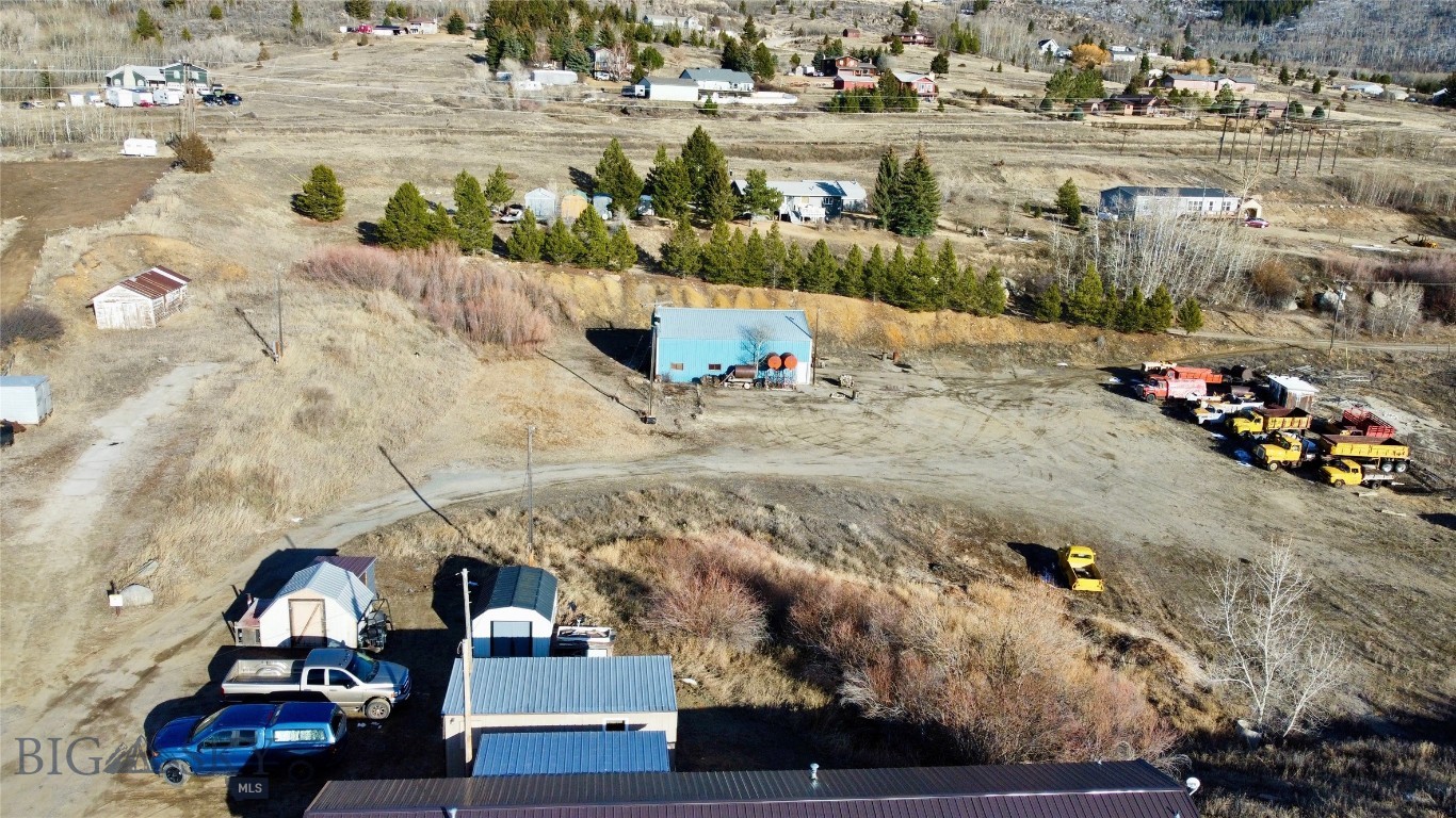 A rare find. 2.6 acres of R1-S zoned land ready for your vision. The property features a spacious 2,000 sq ft shop with finished concrete floors, ideal for a workshop, storage, or hobby space. Two wells and two septic systems are already in place.