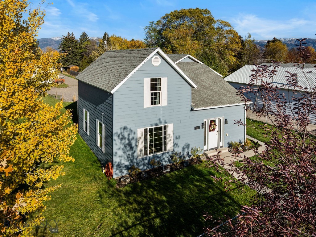 Completely updated while preserving its original charm, this spacious Belgrade home sits on over a quarter-acre lot with a huge yard, just blocks from Main Street and minutes to the airport, schools, and everyday amenities. Thoughtfully renovated from top to bottom, the home features new trim, doors, flooring, tile showers, lighting, and heating—blending timeless character with modern comfort. The kitchen has been fully remodeled with new cabinetry, quartz countertops, and stainless steel appliances, opening seamlessly to the dining area and expansive living room for an easy, connected feel. Three secondary bedrooms and an updated full bath provide flexibility, while the oversized primary suite stands out with a beautiful fireplace centerpiece and generous proportions. The adjoining primary bathroom remains ready for personalization—an opportunity to design a space tailored entirely to your style. Adding tremendous value is the ground-level ADU with private entrance—ideal for guests, rental income, a home office, or business use. Its proximity to the airport and downtown Belgrade makes it especially appealing for flexible living or income potential. With alley access, abundant parking, and a storage shed included, this property delivers both practicality and opportunity—all in a location that offers space and established character beyond the newer subdivisions.