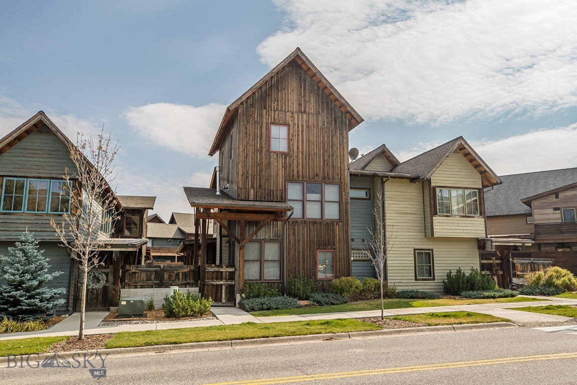 This Essentia condo offers a smart, comfortable layout paired with one of the most convenient locations in Big Sky. With three bedrooms, 2.5 baths, and a two-car garage, it’s an easy fit for full-time living, a vacation home, or a place to land for weekends in the mountains. The main level features an open living area with a gas fireplace, a functional kitchen and dining space, and good natural flow throughout. A dedicated mudroom makes everyday life practical, especially during ski season. Upstairs, a second gas fireplace creates a warm, inviting space to unwind in the second living area. The bedrooms are split between two levels with the primary suite on the second floor and two bedrooms and a full bathroom on the top floor. The guest bedrooms have the advantage of Yellow and Lone Mountain views. The heat pump furnace was replaced within the last year and now provides the condo with central AC. Outside, a private, covered patio extends the living space and is already wired for an outdoor hot tub for relaxing after a day on the trails or slopes. The location really sets this property apart. Just about a quarter mile from Big Sky Town Center, you’re close to restaurants, shops, weekly farmers’ markets, free summer outdoor concerts, and dog-friendly cross-country ski and hiking trails. The skier shuttle to Big Sky Resort is nearby, making mountain access simple year-round. A well-laid-out condo in a walkable, central location, this Essentia home offers convenience and the best of Big Sky living. Please note: the property photos show furnishings, but the condo is being sold mostly unfurnished.