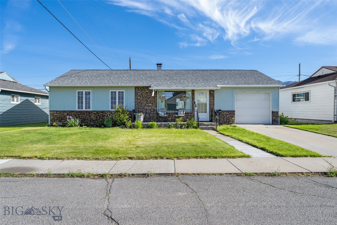 Welcome to 2205 North Drive, located in Butte's popular "Drives" neighborhood near JFK Park and Whittier Elementary School. This 3-bedroom, 1-bath home offers a functional layout, plenty of natural light, and several updates throughout.

Inside, you'll find hardwood floors in the living room, hallway, and primary bedroom, tile flooring in the kitchen and bathroom, and luxury vinyl plank flooring in the additional bedrooms. The kitchen features updated countertops, a large sink, and a sunny eat-in dining area. Main floor laundry adds everyday convenience.

Outside, you'll appreciate the beautiful landscaping and colorful flower beds that create excellent curb appeal. The large lot offers a fully fenced backyard with underground sprinklers, a covered patio, and a spacious storage shed. A one-car garage provides additional storage and parking.

If you're looking for a move-in ready home in a great location, this one is worth a look. Contact your real estate professional today to schedule a showing.