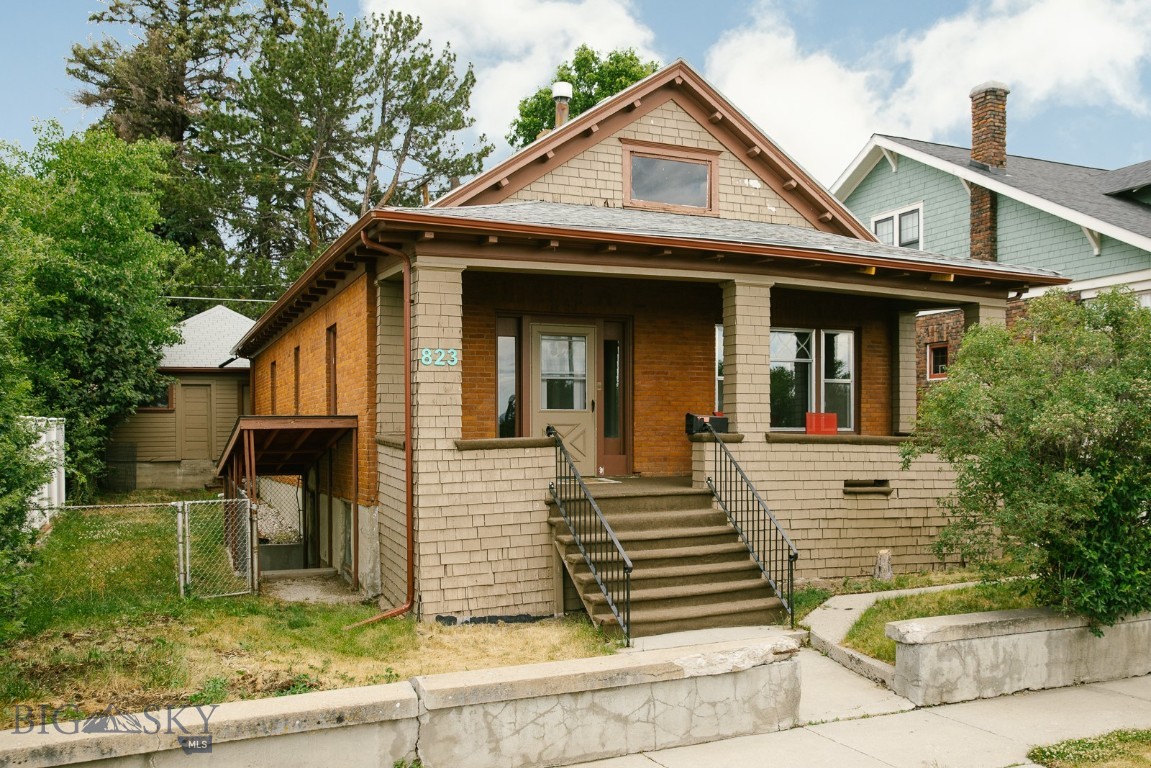 A historic brick home with plenty of curb appeal in the Westside neighborhood of Uptown, located conveniently between the Hospital & Tech. The main level features an entryway, living room, large dining room, 3 spacious bedrooms, a newly remodeled  bathroom, huge kitchen with potential, & laundry room. The home's original character is preserved through its windows, doors, moldings, & high ceilings with modern updates including new flooring & paint throughout the home, new water heater, and a new electrical service. Gaze at the Highlands from the front porch & enjoy a quiet dinner on the back patio. The basement, perfect for storage, has an exterior entrance and a bonus room you can make your own. The double car garage sits off the alley with an automatic garage door, in a fenced-in backyard, on a 5,000 sq. ft lot. Schedule a showing today to see this lovely home!