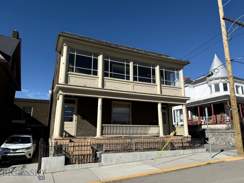 This historic up-and-down style duplex provides generous living space, with each unit designed in a well-considered floor plan. Both units include wood floors, a spacious living room, a wide hallway leading to three sizable bedrooms, a full bathroom, a formal dining room, and a kitchen. The upper unit additionally offers an enclosed sunroom. The basement accommodates a paid laundry area, ample storage, and a utility room. Each unit has its own small garage, suitable for additional storage needs. Close to the hospital, Montana Tech and historic uptown Butte.
The options are many live in one unit and lease the other or purchase as an investment property. Call today to make an appointment to tour this outstanding property. Total square footage of the building is approximately 4,890 sq. ft.