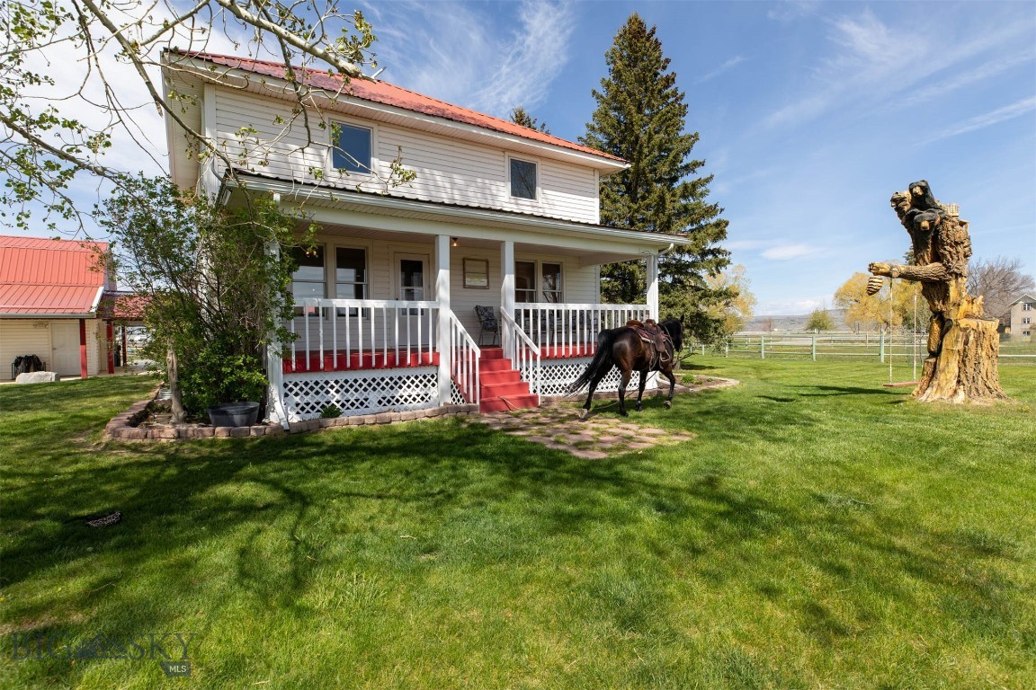 Discover the perfect blend of country living, horse property functionality, and convenience at 6280 Dry Creek Rd in Manhattan, Montana. Situated on 9.66 acres less than one mile from town, this versatile property offers over 7 acres of pasture, is fenced and cross-fenced for horses, and includes valuable water rights, a spring-fed irrigation ditch, and canal access. Whether you’re looking for a hobby farm, equestrian setup, income potential, or simply room to spread out under the Big Sky, this property delivers.

The spacious farmhouse features 4 bedrooms and 3 bathrooms, plus a separate-entry 2 bedroom, 1 bathroom basement apartment ideal for guests, rental income, multi-generational living, or caretaker quarters. Combined, the main house, the bonus space over the garage and the basement apartment are over 3,100 Sq Ft. 
Original hardwood floors on the second level add warmth and character, while the bonus space above the garage offers flexibility for a craft room, workout area, office, man cave, or she shed.

Equestrian and shop enthusiasts will appreciate the impressive 7,000+ square foot Quonset building offering approximately 4,000 square feet of shop space along with 3,000 square feet dedicated to horse stalls, tack room, and additional storage. A round pen is already in place, making this a turnkey horse property ready to enjoy.

Southern exposure captures stunning views, while the paved walking and biking trail bordering the property provides direct access toward the river just over one mile away. Enjoy the peaceful rural setting with the convenience of biking distance to Manhattan schools, downtown amenities, and easy access to Bozeman and Belgrade.
