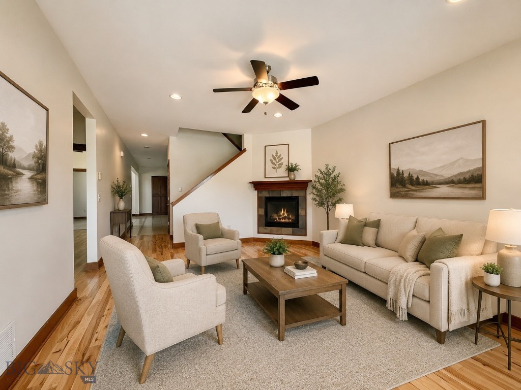 Welcome to effortless living in the highly sought-after White Mountain community! This beautifully maintained 4-bedroom, 2-bath condo offers over 2,000 sq. ft. of thoughtfully designed space, blending comfort, flexibility, and low-maintenance living in one of Bozeman’s most convenient locations.

Designed with functionality in mind, the main level features a spacious primary suite plus two additional bedrooms—perfect for those seeking the ease of main-level living without compromising on space. Upstairs, a versatile bonus room with closets offers endless possibilities as a guest retreat, home office, playroom, or fitness space.

Warm hardwood floors, fresh interior paint, and a cozy gas fireplace create an inviting, move-in-ready feel, while central A/C and ceiling fans provide year-round comfort. The open-concept kitchen, complete with a gas range, seamlessly connects to the bright dining and living spaces—ideal for entertaining, hosting holidays, or simply enjoying everyday life.

Practical features abound, including a spacious laundry/mudroom and an oversized two-car garage with a utility sink for extra convenience and storage.

Outside, enjoy beautifully maintained grounds, a private entrance, reserved parking, and the simplicity of HOA-covered exterior maintenance, lawn care, water, and sewer—giving you more time to enjoy everything Bozeman has to offer.

Located just minutes from Gallatin High, 100-Acre Park, shopping, dining, and trails, this home offers the perfect combination of space, convenience, and lock-and-leave ease. Whether you're looking for room to grow, a low-maintenance lifestyle, or the perfect place to call home—this one checks all the boxes.