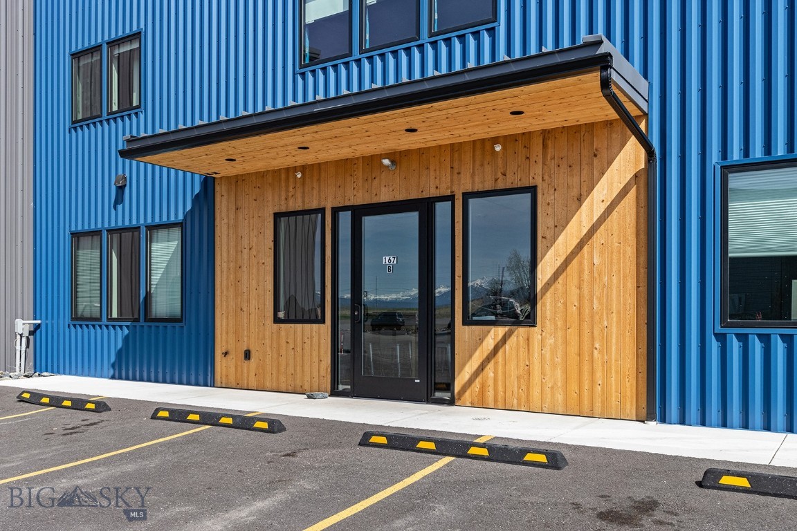 Prime warehouse building for sublease: approximately 9,570 SF, zoned mixed use in Bozeman's rapidly-growing west side.

Built in 2021, the building features a warehouse with office space on two floors.  (1) 20' roll-up door, (2) gas heating units.  The breezeway leads from the warehouse to a common reception area with windows, bathroom, kitchenette, storage closet, (2) private offices, a conference room, a 30' x 30' marketing and video production facility and a communications closet.

The 2nd floor contains (3) private offices, work bench, and an open work area with (6) cubicles.  There is a balcony overlooking the warehouse with steps down to the first floor.  Wifi service and video surveillance across campus.  Landlord pays snow and garbage removal.  Lessee to verify listing details for accuracy.  Note the other building (165 All West Trail) is also listed for sublease: MLS 401544.
