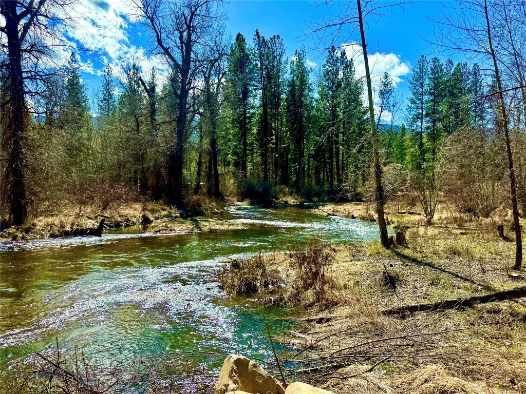 What a display these towering Ponderosa pines create along the scenic Nine Mile Valley in Montana. Stretched along the peaceful Ninemile Creek, these 4.57± acres beckon to the buyer seeking natural beauty, fresh mountain air, and the soothing sound of flowing water that draws wandering wildlife. The property offers several potential homesites, allowing you to design and build the Montana home you’ve always envisioned. Whether you imagine a private cabin, a full-time residence, or a relaxing mountain getaway, this land provides both space and essential utilities to bring your vision to life. The tiny home provides a place to live while building your dream home and a peaceful retreat for guests after where they can enjoy the view of the creek. A well producing approximately 3–5 GPM, along with a 1,200-gallon cistern that can switch to gravity feed as a backup should the power go out. Outdoor recreation abounds in the renowned Nine Mile area, with nearby access to hiking, hunting, fishing, and exploring public lands. In addition to the peaceful, secluded setting, Missoula and its international airport are only about 22 miles away, offering convenient access to amenities while preserving the quiet lifestyle this property provides. Owner financing available with 30% down 8% interest rate over 30 year amortization with balloon payment in 7years.
