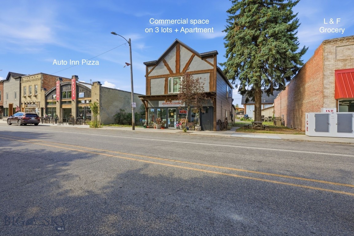 Investment opportunity in the heart of downtown Manhattan, Montana on three individually platted city lots. This recently updated mixed-use building is fully leased and offers a combination of commercial and residential income. 

The street-level commercial space consists of approximately 1,000+ SF open area with desirable Main Street window frontage, providing outstanding visibility and exposure. The open floor plan is well suited for a variety of retail, office, or service-oriented businesses and includes a half bath, rear storage area, and access to an outdoor space located between the retail unit and neighboring grocery store. it also has alley access. Positioned adjacent to L & F Market, the location benefits from excellent foot traffic and a prominent downtown presence.

The upper level features a 1,000+ SF apartment with 2 bedrooms and 1 bathroom. The residence offers two separate access points, including a Main Street entrance and a rear staircase. Recent property improvements include new exterior paint and deck. Both units have designated parking in the rear of building.

Don't miss this opportunity to own an income-producing asset in one of the Gallatin Valley's fastest-growing communities.