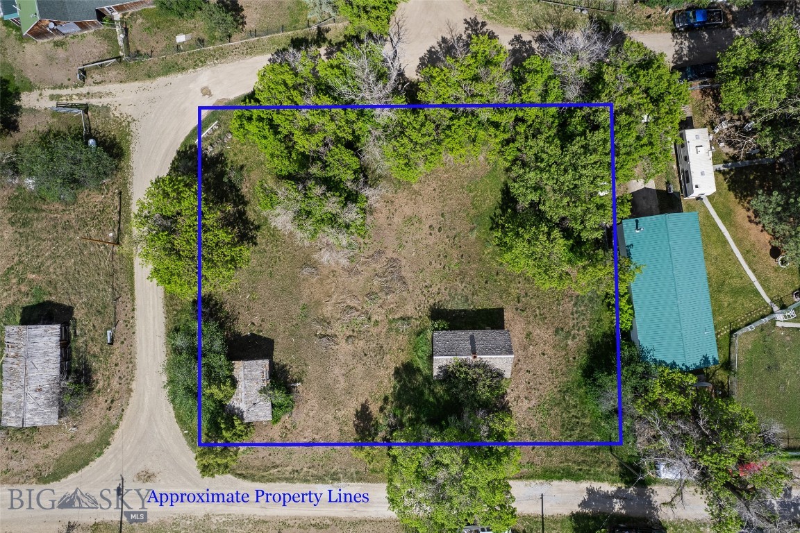 Build your Montana dream on this 0.48-acre lot in historic Radersburg, a quiet former gold-mining town tucked into the foothills of Broadwater County. Comprising Lots 6–10 of Block 10 in the original townsite, this generous parcel gives you room to design the home, cabin, or weekend retreat you've been picturing — with established small-town streets, wide-open mountain views, and the kind of stillness that's getting harder to find. A 14x24 frame shed already stands on site, ready for storage or a workshop while you plan your build. Radersburg sits within easy reach of the Missouri River, Canyon Ferry Lake, blue-ribbon trout fishing, and endless public-land recreation, while Townsend, Three Forks, and Bozeman keep services and travel close at hand. Lots this size, in a genuine Montana townsite, don't come along often. Buyer to verify utilities, zoning, and building requirements with Broadwater County. Come see what space and quiet really feel like.