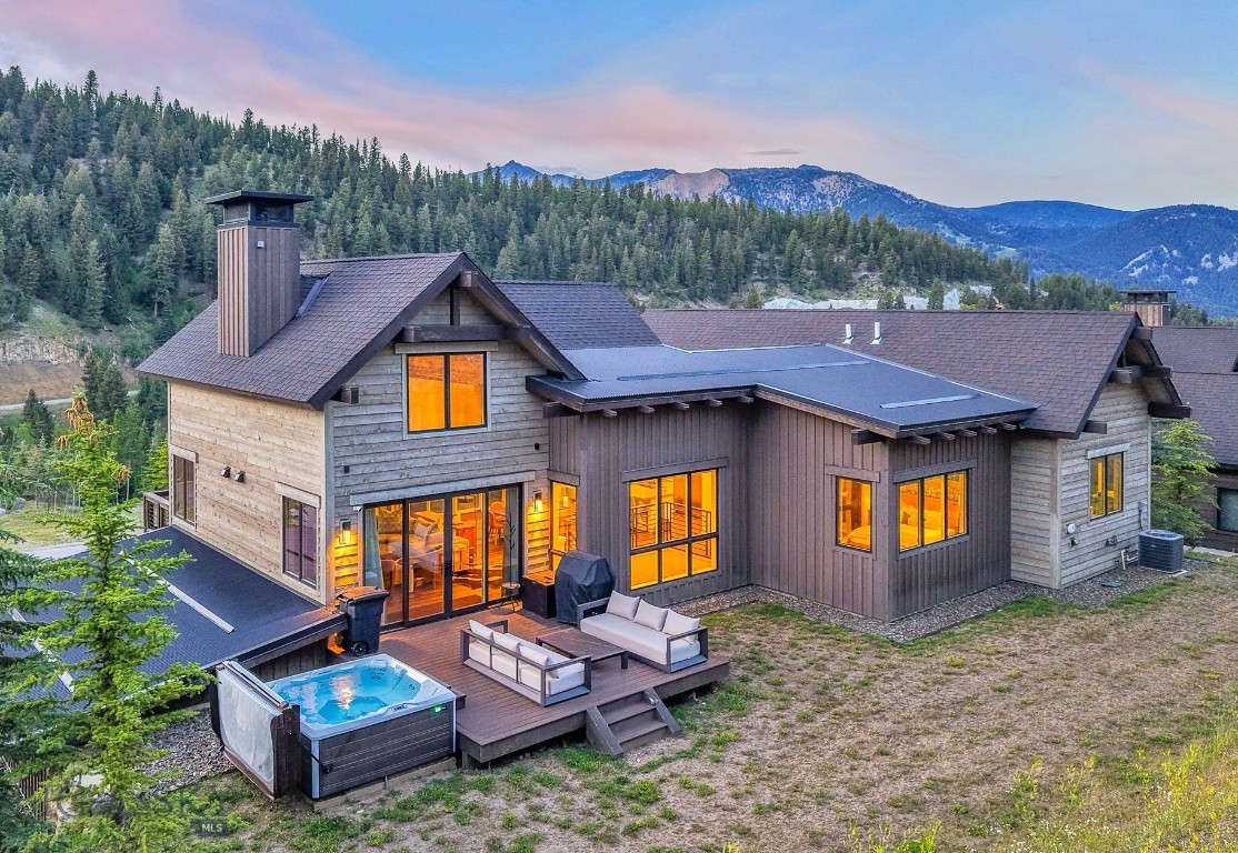 GOLF MEMBERSHIP IMMEDIATELY AVAILABLE! Experience the ultimate mountain lifestyle in this beautifully appointed 5-bedroom, 5-bathroom retreat located in the heart of Spanish Peaks Mountain Club. This move-in-ready residence offers effortless ski-in/ski-out access with a ski trail just across the street leading directly to the Highlands Chairlift — making first tracks a part of your daily routine.
Furnished by a talented local designer, every room showcases tasteful mountain-modern décor and thoughtful finishes. The open-concept kitchen, dining, and living area is flooded with natural light from abundant windows, while the lower-level family room—with a wet bar—offers the perfect setting for après-ski relaxation or entertaining. Multiple outdoor decks and a private hot tub area invite you to take in the surrounding views in every season.
Ownership includes access to the exclusive amenities of Spanish Peaks Mountain Club: private ski and hiking trails, two world-class golf courses (with golf membership), tennis and pickleball courts, state-of-the-art fitness centers, swimming pools, and elevated dining at the Clubhouse. Members also enjoy preferred access to the five-star services of Montage Big Sky.
Looking ahead, the soon-to-open Aspire Lodge — a 28,000-square-foot amenity center featuring a restaurant, fitness facility, basketball court, climbing wall, and two outdoor pools — will be just a short stroll from your front door, with completion anticipated in 2026.
Membership at Spanish Peaks Mountain Club is required upon closing. This is your chance to own a fully furnished, turn-key mountain sanctuary with unmatched access to recreation, relaxation, and luxury.