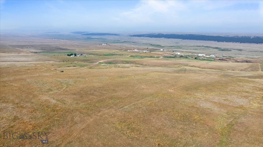 This exceptional 200-acre vacant land offering is located just outside Lewistown, delivering the space, views, and versatility Montana land buyers seek. Bordering 320 acres of BLM, the property enjoys expanded access to public land—ideal for grazing, recreation, and long-term value. The land features grazing potential, a seasonal spring, and wide-open terrain with expansive mountain views in every direction. Whether you’re looking to develop, build a private retreat, or hold as a legacy investment, this acreage offers flexibility and opportunity. Quiet, private, and rich with Montana character, the property provides a rare combination of size, public land adjacency, and proximity to town. A prime Central Montana offering well-suited for ranch use, recreation, or future development potential. Can be purchased with additional 80 acres, home, outbuildings, and 320 acre BML grazing allotment for $1,500,000 (MLS# 405650).