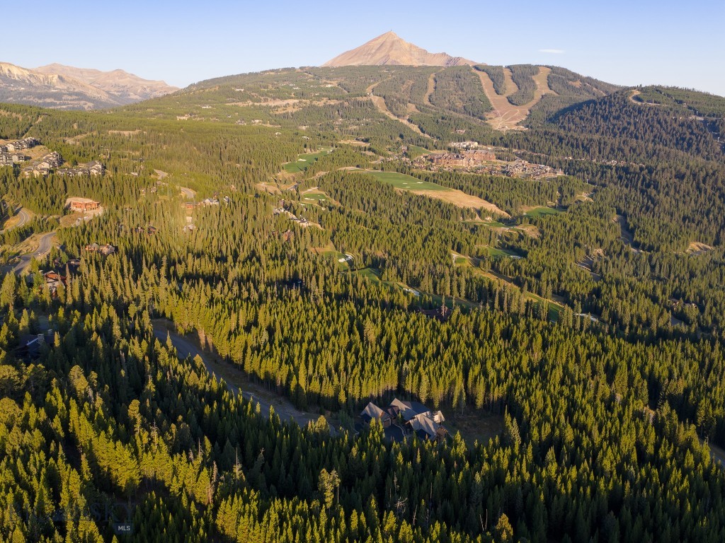 Ideally located on a quiet cul-de-sac in Spanish Peaks Mountain Club, this 1.33-acre lot captures sweeping views of Lone Peak, the Spanish Peaks range and Pioneer mountain. Short distance to the Clubhouse and Montage Big Sky; enjoy direct access to skiing, golf, dining, and year-round recreation. Offered with complete architectural plans for a 7-bedroom, 7-bath mountain modern home. Design features include four fireplaces, chef’s kitchen and pantry, bunk and media rooms, wet bar, and covered outdoor living spaces with fireplace, grill, and hot tub. Buyer must be approved for Spanish Peaks membership which is required with purchase. An exceptional lot to build on immediately in one of Big Sky’s most desirable, private clubs.