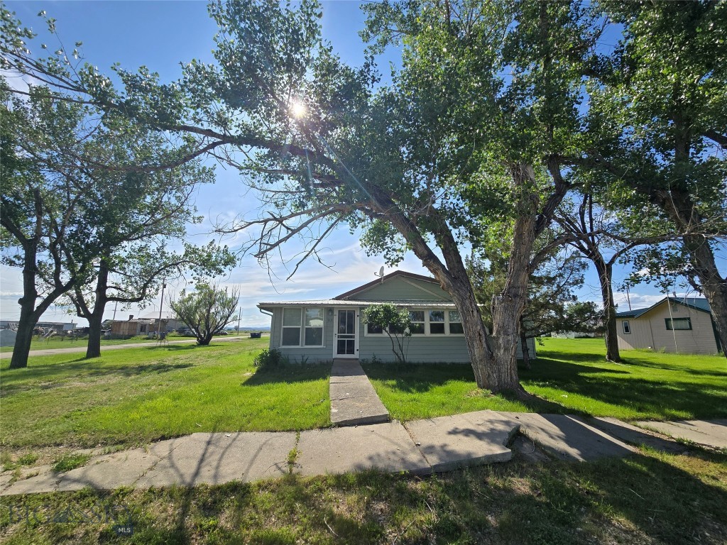 The seller loves the quiet and peaceful surroundings of this home, and that feeling of calm is the first thing you notice as you arrive. The enclosed front porch welcomes you with warmth and versatility, offering a place to sip morning coffee, store gear, or enjoy the seasons. Step inside to find original wood floors that add character and can shine again with some refinishing. Natural light flows through the home, highlighting the potential in every room. While updates are needed, important features like a steel roof added around 2017 and newer windows give the next owner a solid foundation. The attached pole barn-style garage with a dirt floor includes a spacious 24 x 36 shop that is ideal for storage or hands-on projects. For anyone seeking a fixer-upper with charm, structure, and room to grow, this home offers a welcoming starting point in a peaceful location.  Info deemed reliable but not guaranteed. Buyer/buyer agent to verify.
