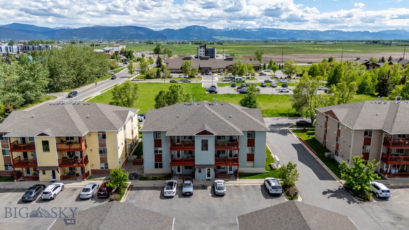 Tired of shared hallways and generic condo living? This ground-level end unit lives more like a townhome, boasting a private entrance and a personal patio—perfect for easy grocery trips, enjoying the fresh Montana air, or accessing the scenic trails at Bozeman Pond. 

The interior features an open-concept living space with a cozy fireplace, built-in shelving, and a kitchen breakfast bar designed for seamless entertaining. The thoughtful floor plan includes a convenient powder room off the main area and two well-sized bedrooms with an additional full bathroom. Just steps from your unit is a private one-car garage offering secure parking or a dedicated storage solution for outdoor gear.

The location is truly unbeatable. You are situated directly across from Bozeman Pond, offering instant access to outdoor recreation, yet you remain just minutes from the MSU campus and the shops, restaurants, and grocery stores of downtown Bozeman. This condo provides the perfect blend of proximity, privacy, and practicality.

The Seller is offering a $5,000 credit to be used toward Buyer's closing costs, pre-paids, or rate buydown! Please note that this unit must be owner-occupied due to current HOA rental ratios. The interior was freshly painted with the exception of the turquoise bedroom, and some photos have been virtually staged to show the unit's full potential.