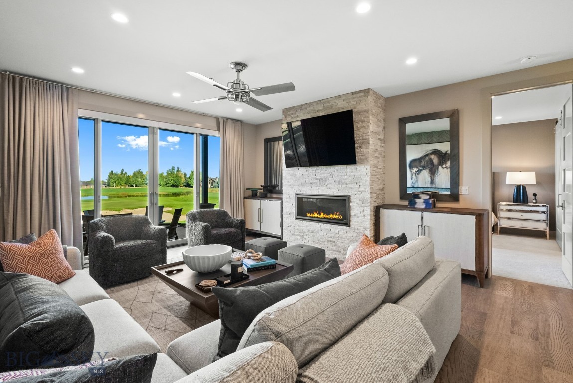 TURNKEY and professionally designed, this exceptional Villa is offered FULLY FURNISHED with all, excellent condition, designer furnishings, artwork, décor, kitchenware, and accessories included—allowing for an effortless move-in experience just in time for summer. Thoughtfully curated by the team at Gallatin Valley Furniture, every detail of this 2-bedroom, 2.5-bath residence was meticulously selected to create a rich, elevated aesthetic layered with custom textures, finishes, and color throughout. From the custom wallpaper, designer lighting, automated window coverings, and tailored closet systems to the custom furnishings and rugs, every element was intentionally designed and remains in pristine condition, only used a handful of times. The oversized covered patio extends the living space outdoors with a gas fireplace and sweeping views overlooking the golf course, ponds on holes #1 and #9, and the western mountain ranges. Inside, the chef’s kitchen features an oversized island, GM Monogram appliances, a spacious pantry, and a bar area complete with a beverage fridge. Additional features include an attached heated garage, washer and dryer, and the ease of a true lock-and-leave lifestyle. This is a rare opportunity to step directly into a fully realized luxury residence where every detail has been considered and executed.