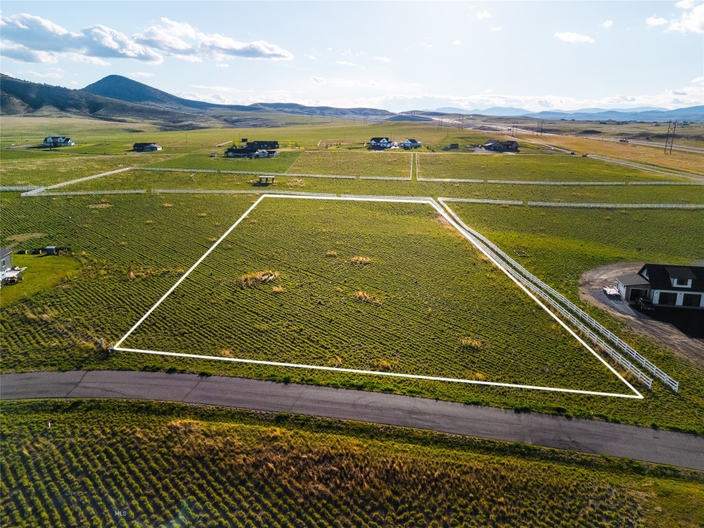 Discover the perfect setting to build your Montana dream home at 12 Lewis Drive in the highly sought-after Colter’s Run Subdivision near Three Forks. Surrounded by panoramic mountain views, rolling hillsides, and wide-open skies, this property offers the ideal balance of peaceful country living and convenient access to adventure.

What sets this lot apart is that much of the heavy lifting has already been completed for you. Soil testing, well logs, geotechnical engineering, and DEQ-approved build site documentation are already in place—giving buyers added confidence and helping streamline the building process.

Colter’s Run is designed for those who want room to breathe and space to enjoy the Montana lifestyle. The community features paved roads, power to each lot, over 15 acres of dedicated park space, scenic trail systems, and protective covenants that preserve the beauty and value of the neighborhood. Build a custom single-family home along with a guest house and shop, barn, or garage. With allowance for up to two horses, this equestrian-friendly community is ideal for those seeking both recreation and freedom.

Outdoor opportunities are endless with easy access to the Gallatin, Jefferson, and Madison Rivers, Missouri Headwaters State Park, and Copper City Trails bike park. Whether your perfect day includes fly fishing, horseback riding, mountain biking, or simply enjoying sunset views from your future back porch, this property puts it all within reach.

Located just minutes from Three Forks and approximately 30 minutes from Bozeman with quick access to I-90, this is a rare opportunity to create the Montana lifestyle you’ve been dreaming about.