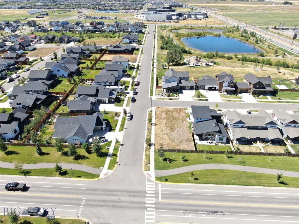 Prime Corner Lot in desirable Flanders Mill Neighborhood
This mature corner lot is one of the few remaining in the desirable Flanders Mill neighborhood, now in its final development phase. Nestled within the 137-acre neighborhood, the property enjoys an ideal location in terms of access to schools, parks, and major commercial and institutional centers. 
Situated within walking distance of three public schools – Meadowlark Elementary, Chief Joseph Middle School, and Gallatin High School, two Christian Schools are also nearby – Petra Academy and Heritage Christian, both accredited Pre-K through 12th-grade. The property is also close to two neighborhood parks – Diamond Park and Oak Springs Park, as well as Gallatin Regional Park, all within a quarter mile; Bozeman Sports Park is only 0.6 miles away. The neighborhood’s 36 acres of dedicated open space include streams, a pond, playgrounds, and picnic areas; the Westside Loop portion of the extensive Bozeman trail system provides pedestrian access throughout the area. The Bridger Mountain Range offers views to the east with glimpses of the Gallatin Mountain Range to the south.  Street trees were installed several years ago to further enhance the property. 
Major destinations within the metropolitan area are readily and easily accessible from the property: the Historic Core and Central Business District, the regional retail hub, and the Montana State University campus are just a 10-minute drive.  Bozeman Yellowstone International Airport and the Bozeman Deaconess Hospital are within a convenient 20-minute drive.  The city boasts an impressive array of sports and recreation facilities, including soccer, lacrosse, rugby, tennis, pickleball, and indoor sports. It is also a year-round hub for outdoor recreation, including skiing, fly fishing, hiking, and rock climbing. 
Bozeman itself enjoys a wonderful location in the Greater Yellowstone region, with an array of accessible public lands within an hour’s drive. The area is an outdoor recreation paradise. Two major ski areas are easily accessible – Bridger Bowl (30 min) and Big Sky Ski Area (1 hour), and the world-class fly fishing waters of the Madison River (1.5 hours).  Old Faithful in the heart of Yellowstone National Park is a mere two-and-a-half-hour drive, and majestic Grand Teton National Park is just a half-day away.