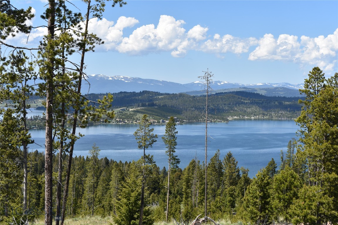 A rare 2.07-acre parcel perched above Georgetown Lake, just west of Anaconda. The elevated homesite commands sweeping views across the water to the soaring peaks of the Pintler Range, while offering sunrise and sunset drama over the lake and surrounding timber.

Only minutes from Discovery Basin Ski Area and surrounded by endless public land and trails, the property combines mountain recreation with seclusion. With room to build a custom home or cabin designed to capture the panoramic views, this lot delivers the kind of setting that’s increasingly hard to find in the Montana Rockies.