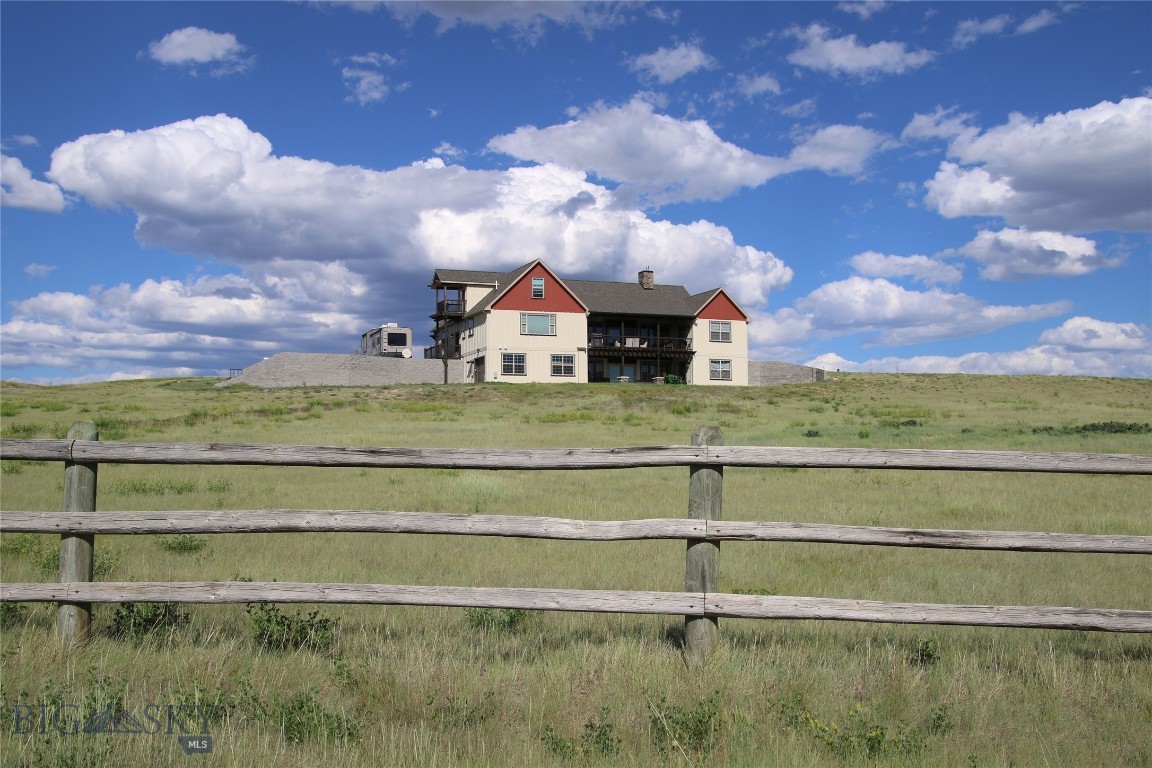 Embrace the Montana Lifestyle

Welcome to your private retreat set on 5 acres of breathtaking Montana landscape. This 3,200 square-foot home offers a perfect blend of comfort, style, and opportunity, surrounded by sweeping mountain views and open meadows that define Big Sky Country.

Featuring 4 spacious bedrooms and 3.5 bathrooms, the home is thoughtfully designed for both everyday living and entertaining. An open-concept layout welcomes you with abundant natural light pouring through large windows, creating bright, inviting spaces throughout. The living area showcases stunning panoramic views and unforgettable sunsets—your daily backdrop to peaceful living.

The main level offers ample space to gather, whether hosting guests, spending time with family, or simply relaxing while taking in the scenery. Downstairs, a 2,000 square-foot unfinished basement provides endless possibilities—create a home theater, fitness room, guest suite, or additional living space tailored to your needs. It also presents excellent potential for rental income or multi-generational living.

A 3-car garage adds convenience, while the expansive property allows room for a future shop, barn, or custom outdoor retreat. Designed for enjoying the outdoors, the home features both a deck and covered patio—ideal for summer gatherings, quiet mornings, or evenings under Montana’s star-filled skies.

Livestock-friendly and rich with opportunity, this property is perfect for those seeking a rural lifestyle without sacrificing modern comforts. Located in a charming small town, you’ll enjoy a sense of community while still having privacy. The heart of Three Forks, with its dining, events, and daily conveniences, is just minutes away, while Bozeman and Butte are both within an easy drive.

More than just a home, this property offers a lifestyle—where space, serenity, and possibility come together. Experience Montana living at its finest, where every view inspires and every day feels like a retreat.