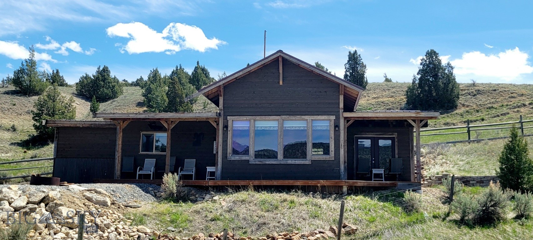New Listing July 1, 2026- A Great  Get-away Home with an amazing view of the Ruby Reservoir just out Alder Montana. So many and diverse outdoor activities are so close to this property - Hunting for Garnets along the banks of Ruby Reservoir to riding your side-by-side to the nearby BLM and Forest Service.  If you want to hunt big game this property is in just the right spot.  Fly fishing the Ruby River, the first of 3 fishing accesses between this property and Alder, is just 1/2 mile from home, Water ski, jet ski, wind surf and lake fishing all available just out the front door.  Winter activities include Ice Fishing and snow mobiling. This home has approx. 820+/- sf and 270+/- s.f of covered deck for outdoor living space with pretty amazing views.  Each of the 2 bedrooms have currently bunk beds with the sofa pull-out bed in the living space for your guests.  Seller will include most furnishings (no head mounts or personal possession) with a full price offer.  With no covenants so no restriction on Short Term rentals  for those want to use this property occasionally.  A second home/cabim is already permited for a septic system and site pad is currently  being created by owner.
There is plenty of space, fenced in below the cabin with gravel to water hydrant and plenty of room for your kayak, canoes, side-by-sides or parking for large gatherings.  Call for a showing or view this property.  Updated video tour will be available soon!