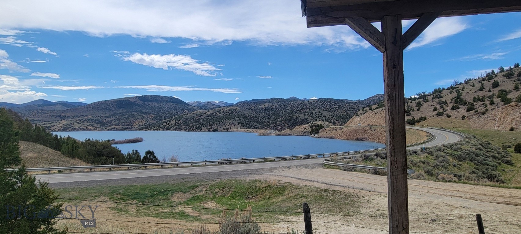 New Listing July 1, 2026- A Great  Get-away Home with an amazing view of the Ruby Reservoir just out Alder Montana. So many and diverse outdoor activities are so close to this property - Hunting for Garnets along the banks of Ruby Reservoir to riding your side-by-side to the nearby BLM and Forest Service.  If you want to hunt big game this property is in just the right spot.  Fly fishing the Ruby River, the first of 3 fishing accesses between this property and Alder, is just 1/2 mile from home, Water ski, jet ski, wind surf and lake fishing all available just out the front door.  Winter activities include Ice Fishing and snow mobiling. This home has approx. 820+/- sf and 270+/- s.f of covered deck for outdoor living space with pretty amazing views.  Each of the 2 bedrooms have currently bunk beds with the sofa pull-out bed in the living space for your guests.  Seller will include most furnishings (no head mounts or personal possession) with a full price offer.  With no covenants so no restriction on Short Term rentals  for those want to use this property occasionally.  A second home/cabim is already permited for a septic system and site pad is currently  being created by owner.
There is plenty of space, fenced in below the cabin with gravel to water hydrant and plenty of room for your kayak, canoes, side-by-sides or parking for large gatherings.  Call for a showing or view this property.  Updated video tour will be available soon!