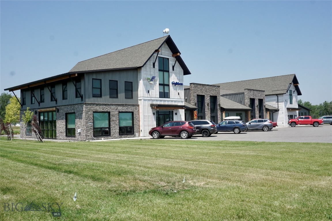 Class A office space just south of Four Corners on your way to Big Sky. Unit C is configured in an open bullpen style layout with a second floor that could be used as a conference room or additional office space. The front of the unit is partially separated from the back and could be used as a reception area or retail space. Other features include an overhead garage door with access to the back parking lot, built-in kitchenette, security system with remote access control and ample parking.