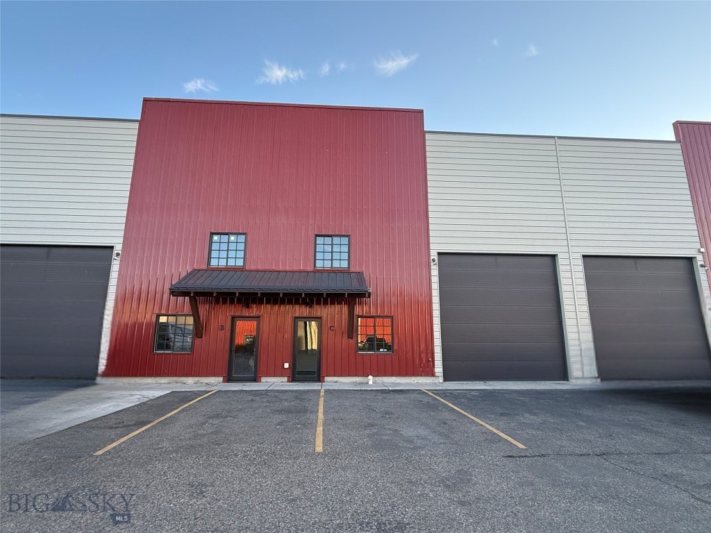 Highly functional 1,914 SF warehouse space located in the sought-after Four Corners area, designed to support a wide range of commercial and light industrial uses. The space features a spacious mezzanine for additional storage or flexible use and one private restroom. A dedicated customer entry provides a professional front-facing presence, while a 14-foot overhead door allows for efficient loading and operations. Each unit includes three allotted parking spaces, with additional street parking available. This property offers a practical layout, strong accessibility, and a prime location near major routes.